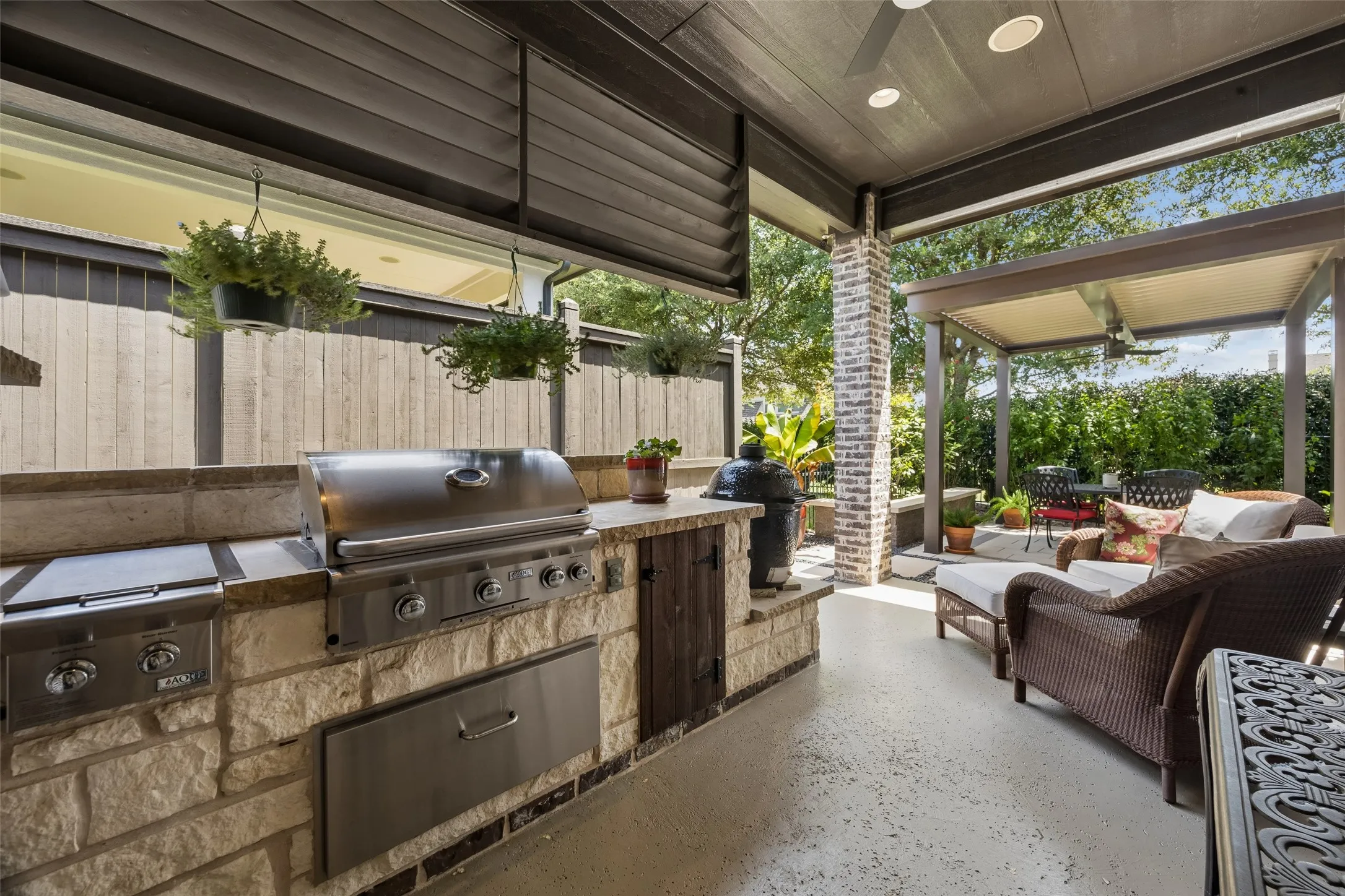 Outdoor grill Center and covered seating area.