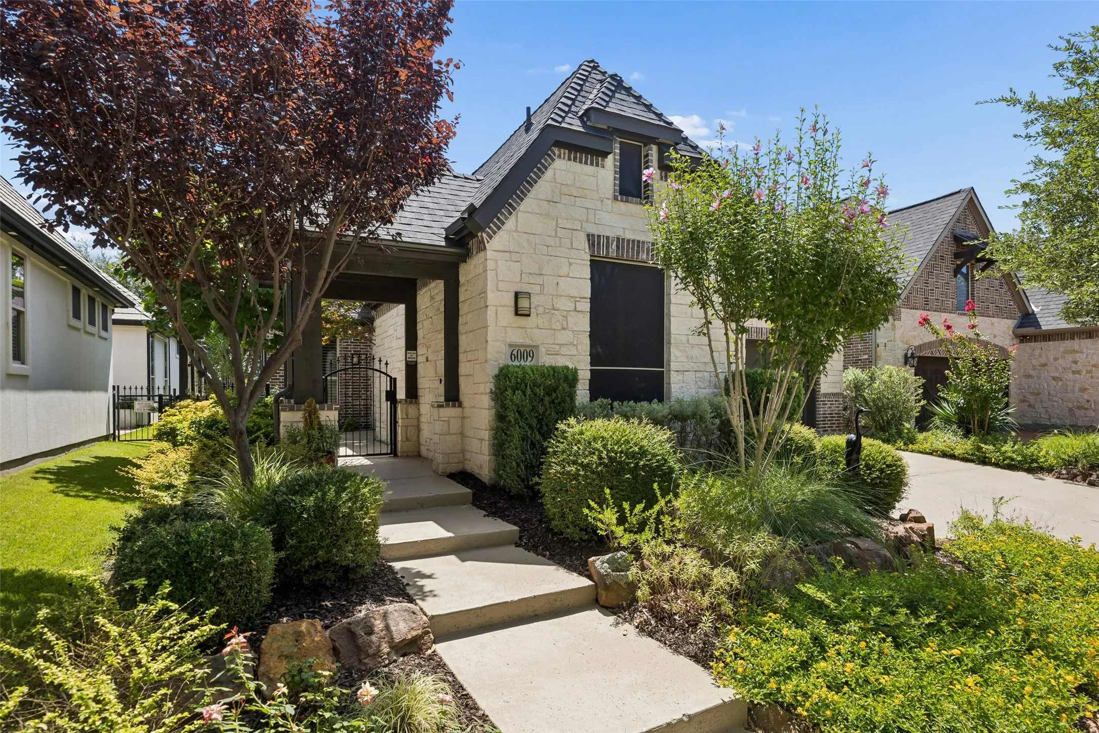 Beautifully landscaped with thoughtful seasonal plantings.