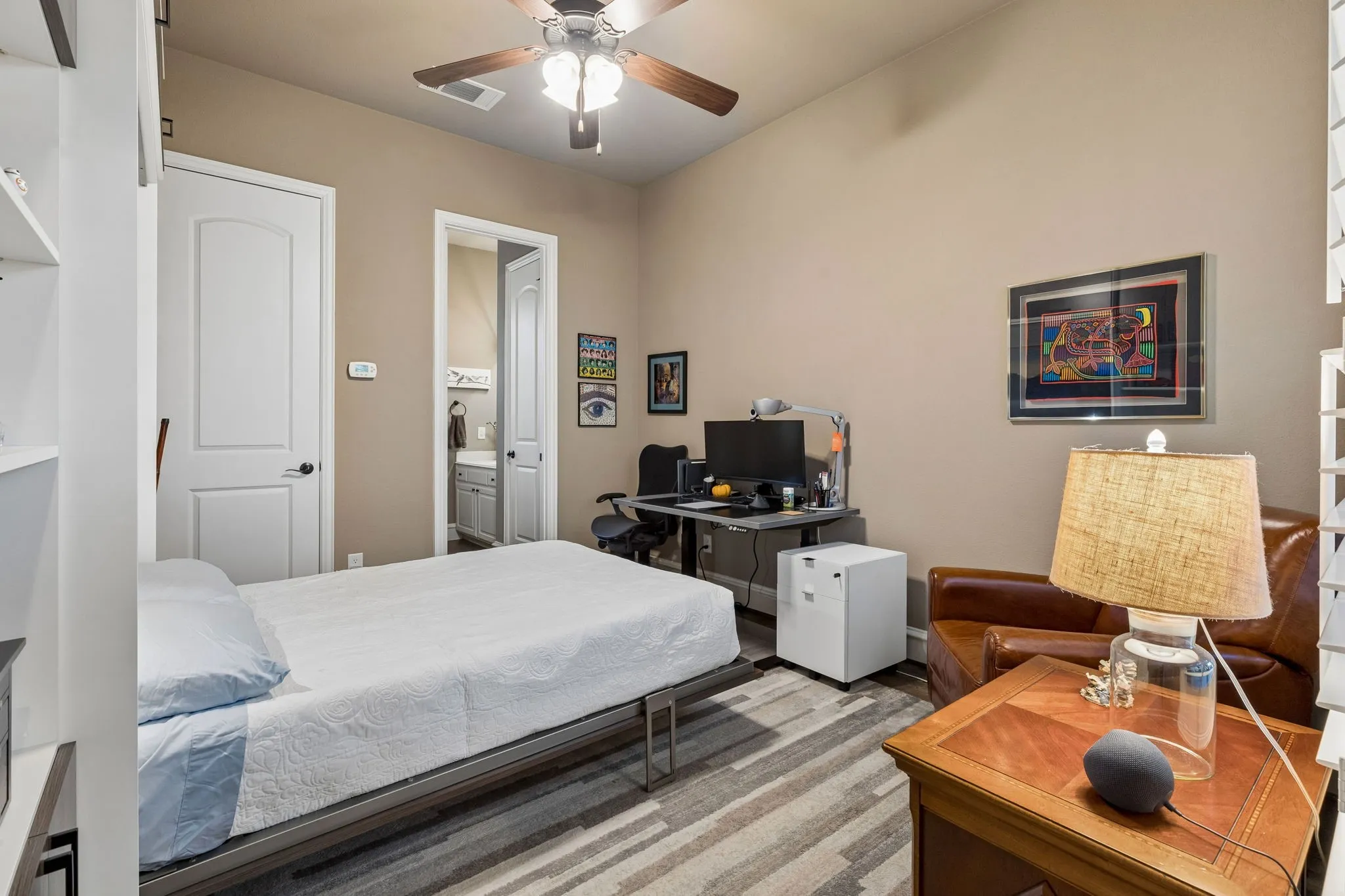 Secondary bedroom has a custom built murphy bed that offers flexibility of the room.