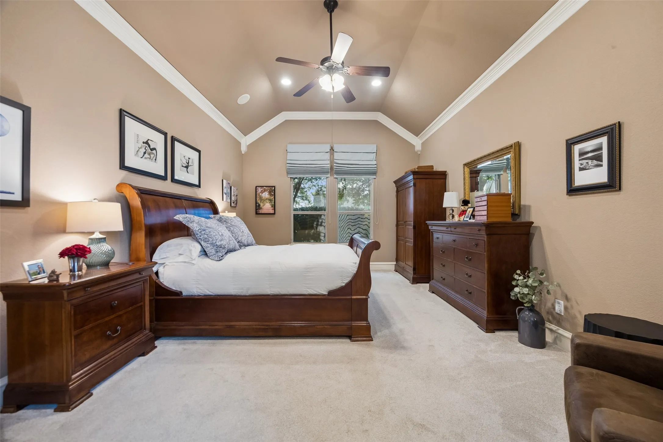 Primary bedroom overlooks the backyard and has a sitting area.