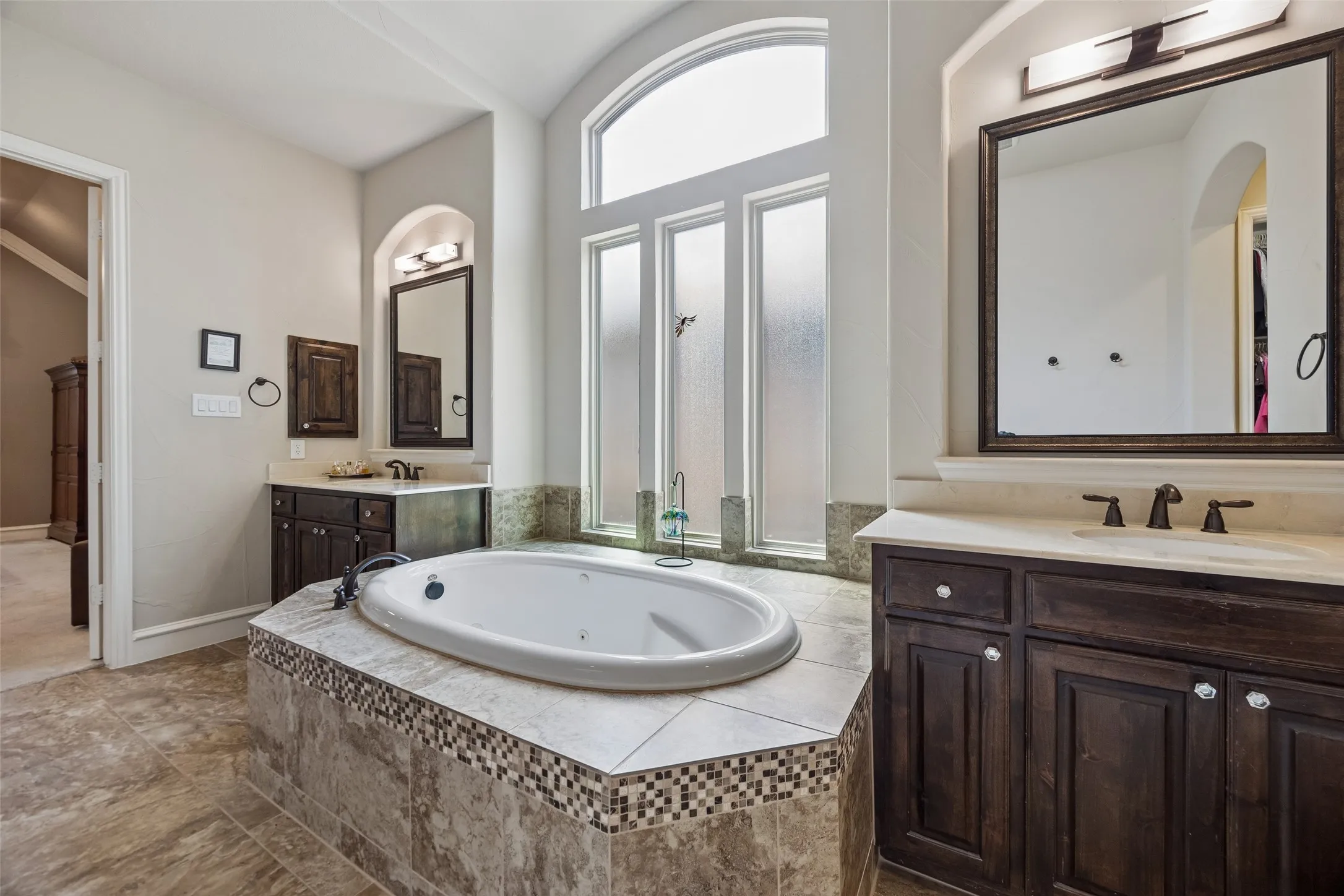 Dual vanities with medicine cabinets.