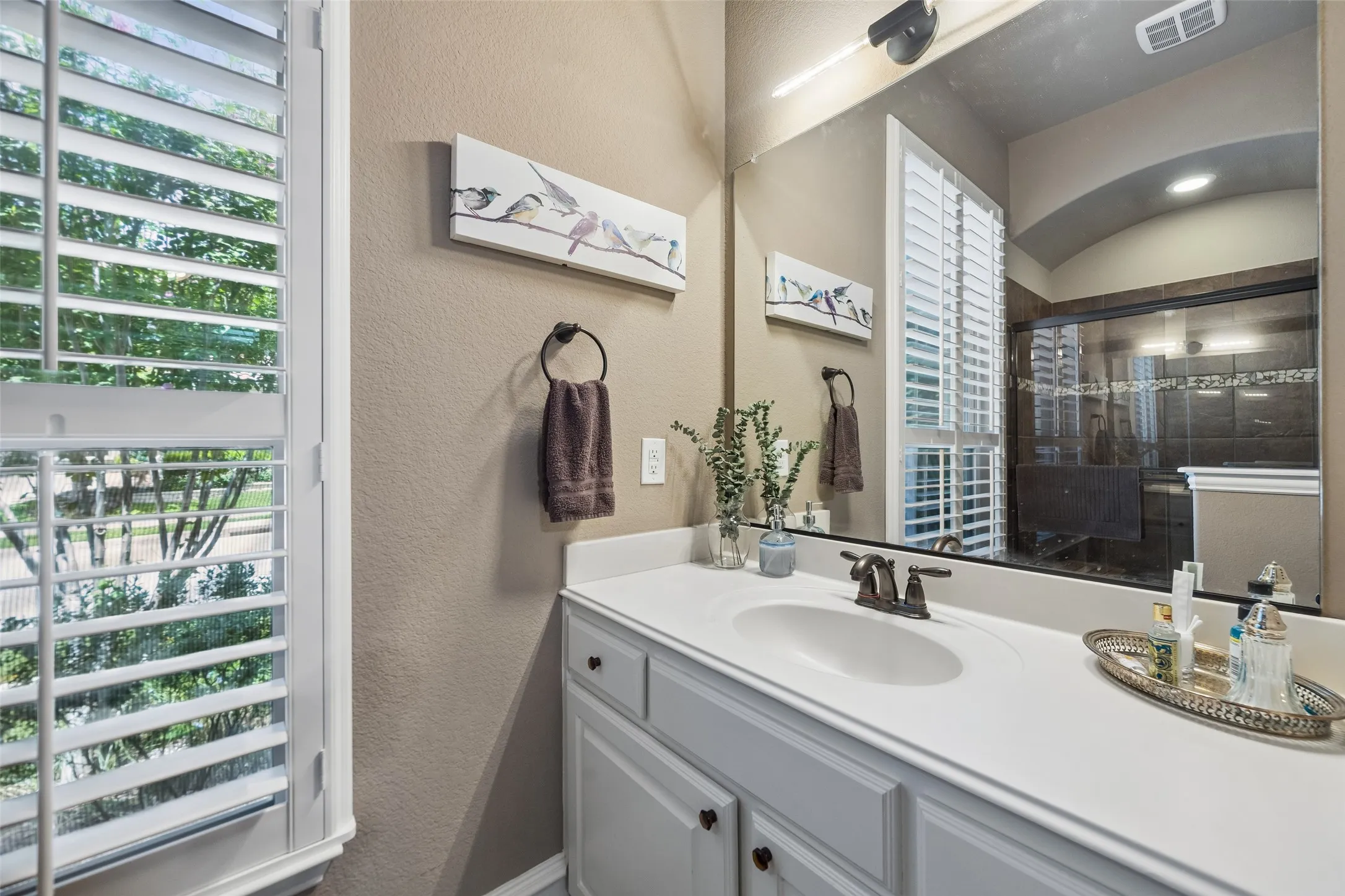 Additional secondary full bathroom with walk in shower.