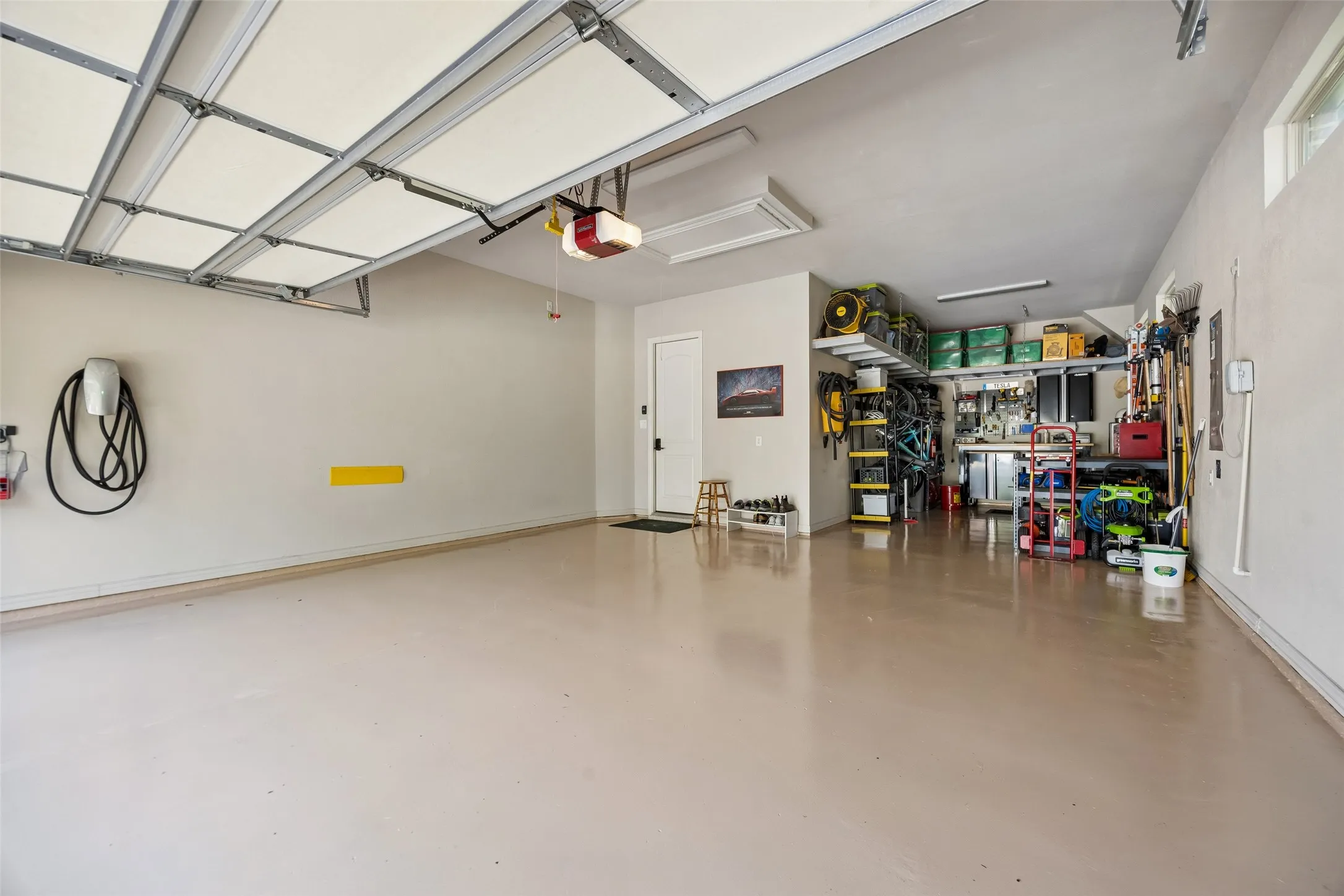 3 car tandem bay garage with built in storage racks.