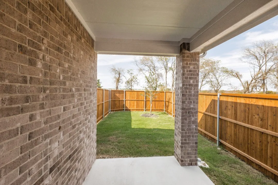 Fenced backyard with covered patio/deck