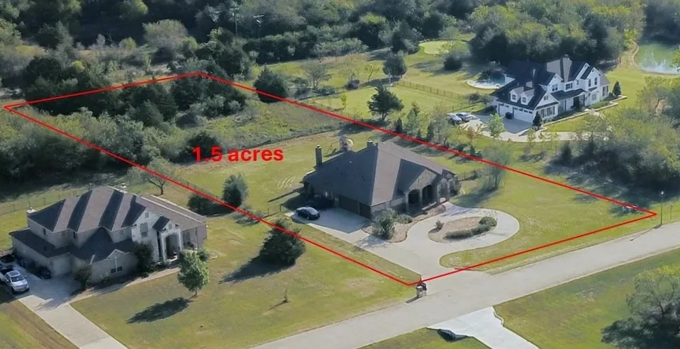 1.5 Acre lot with front circular Drive and side swing 3 Car Garage