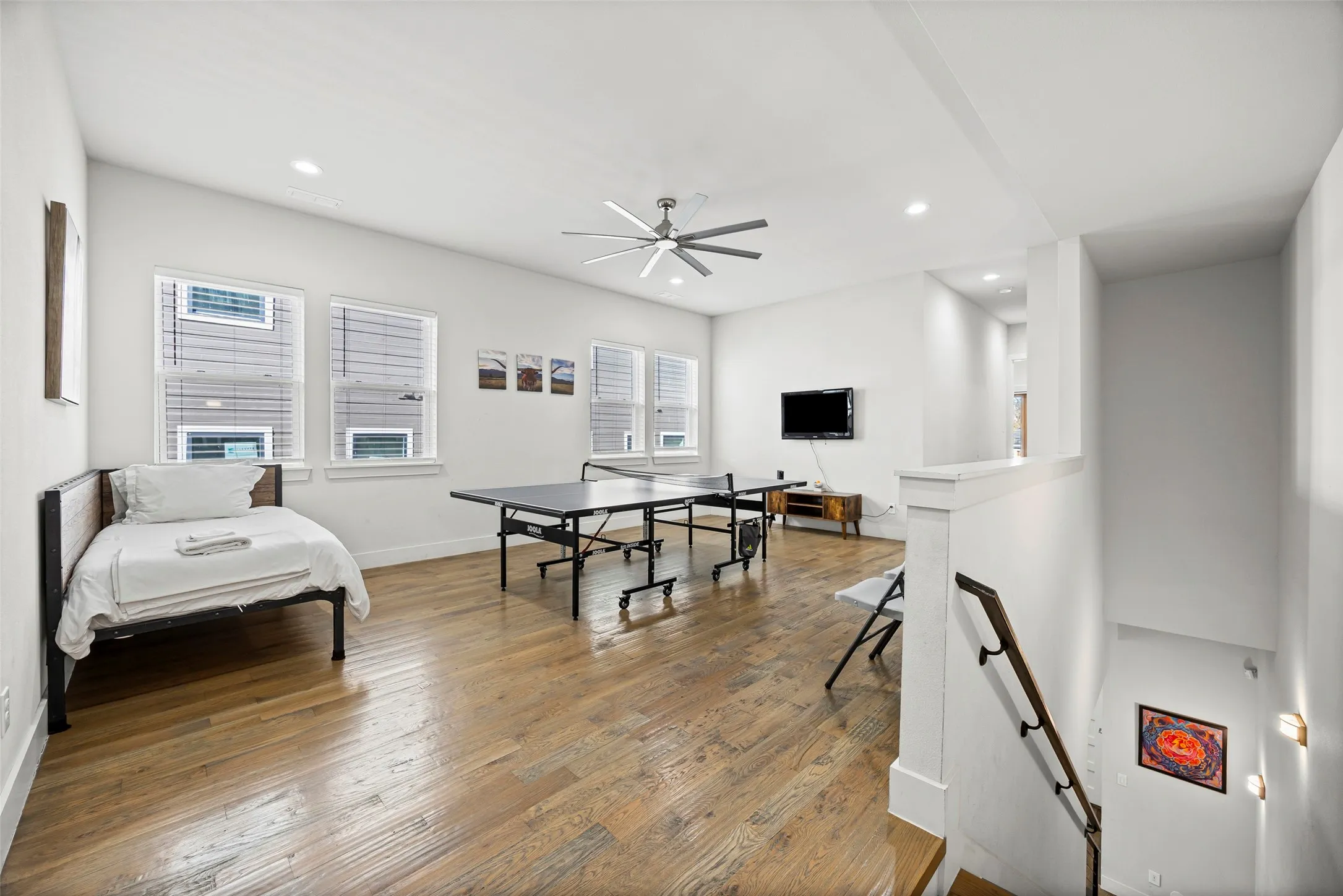 At the top of the stairs, you will find a large family room
