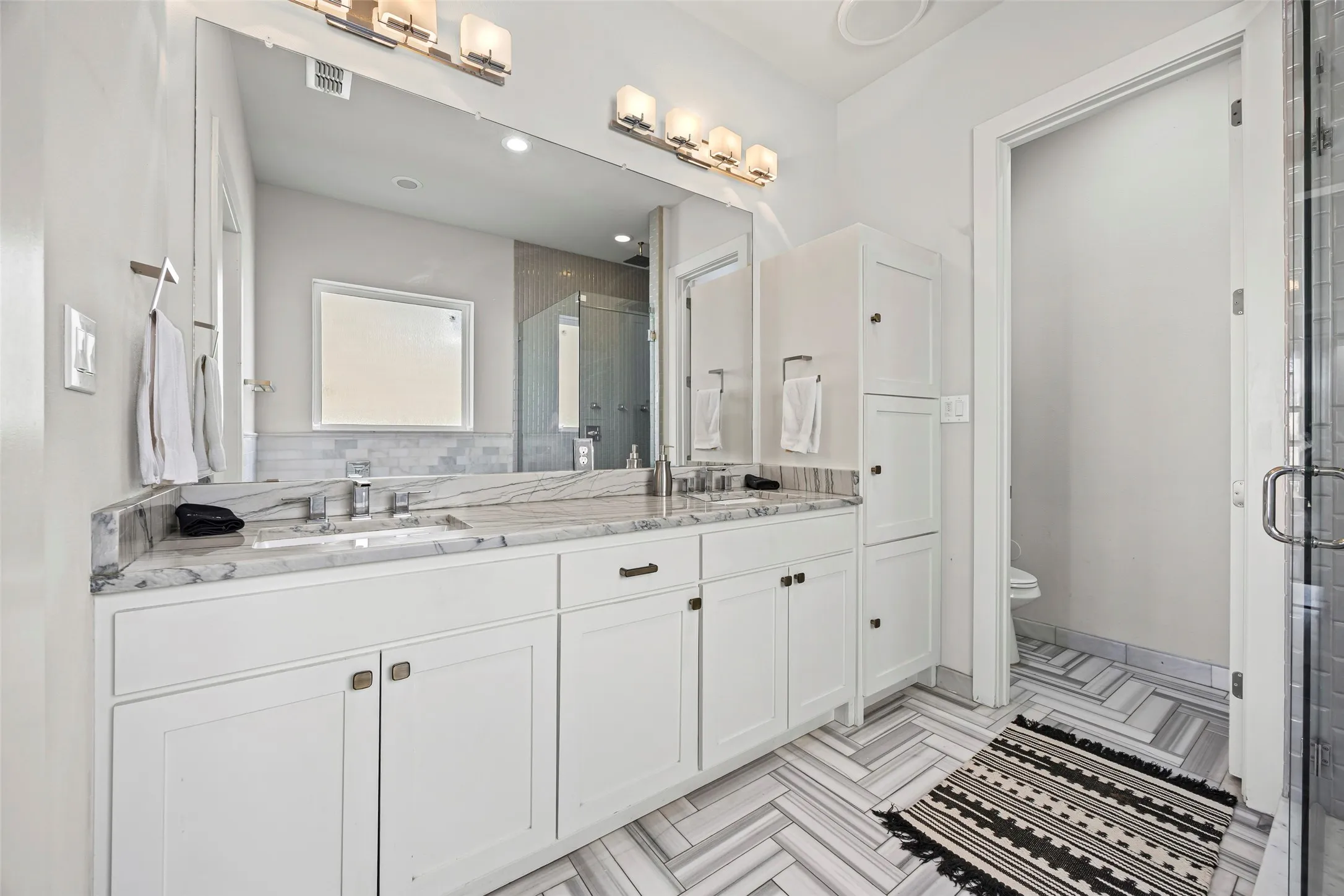 Primary bathroom features free-standing tub, shower and double sinks