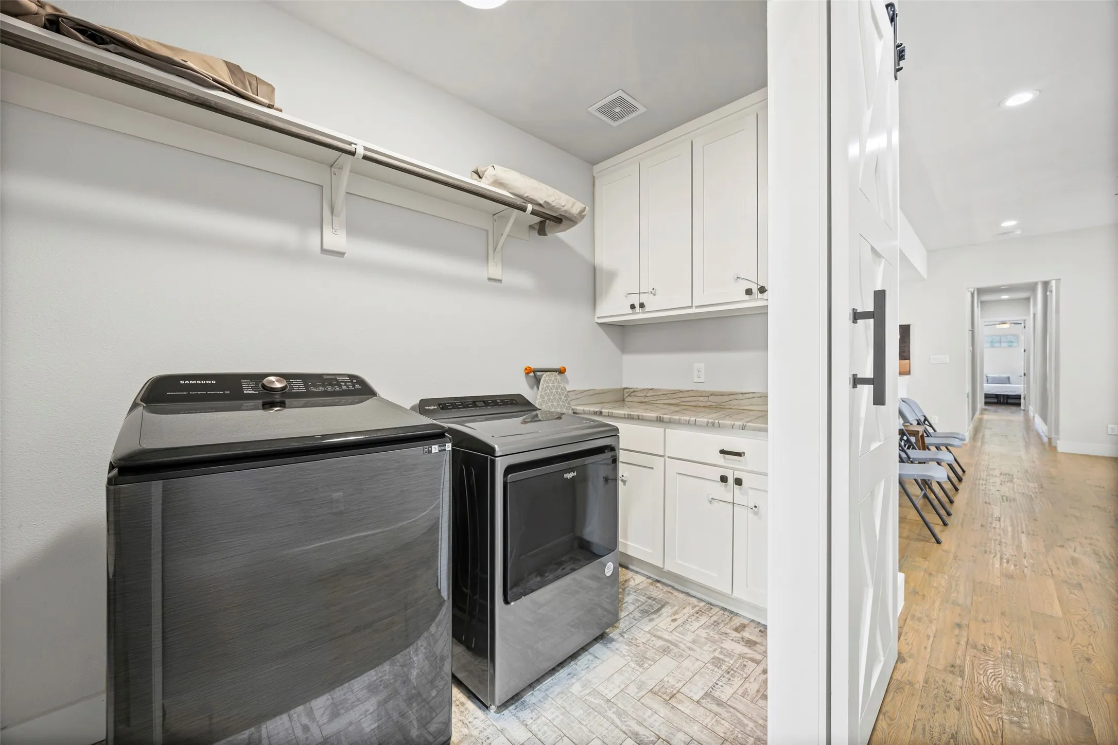 Upstairs laundry room is convenient to all of the bedrooms