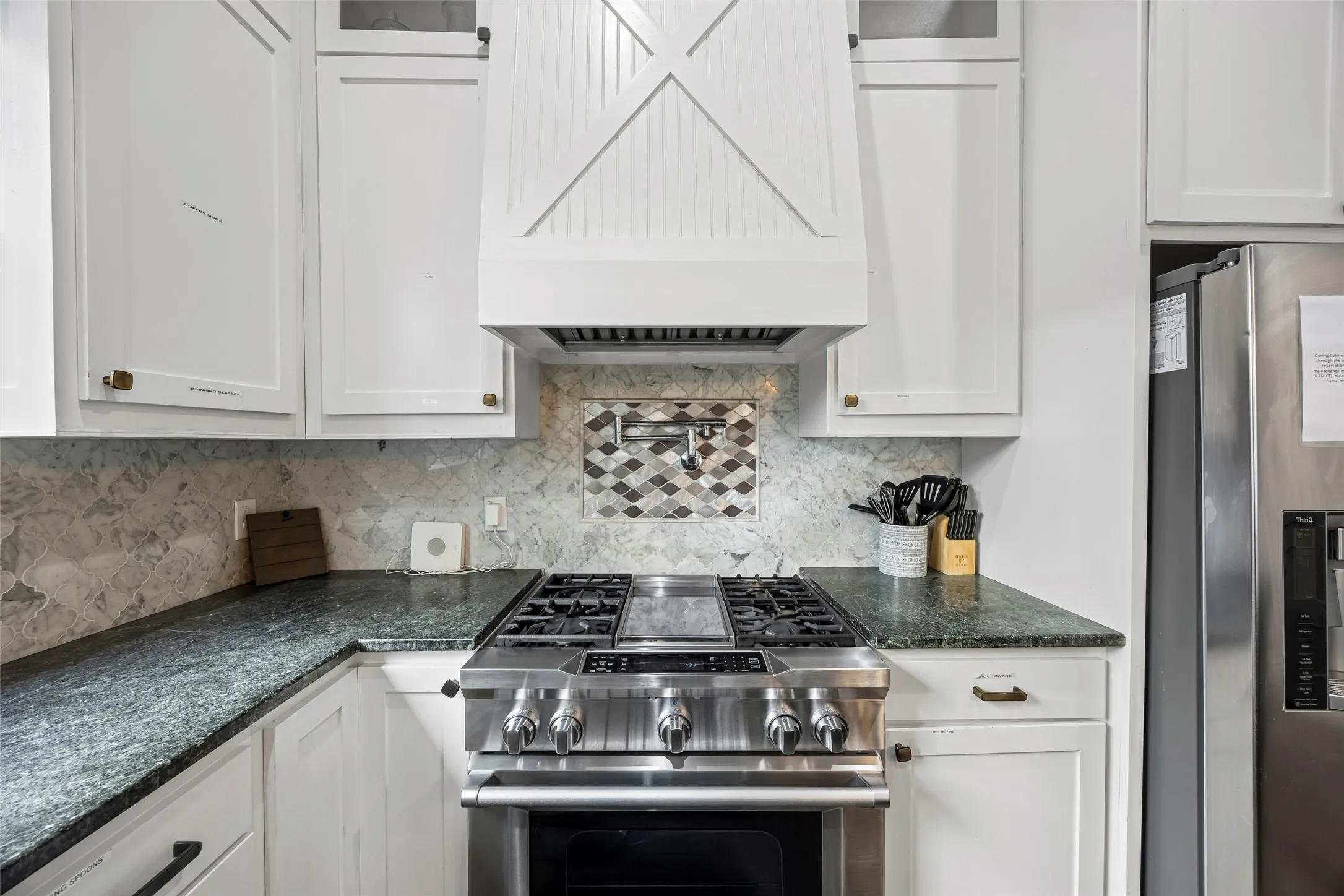Gas stove with griddle with a convenient pot filler