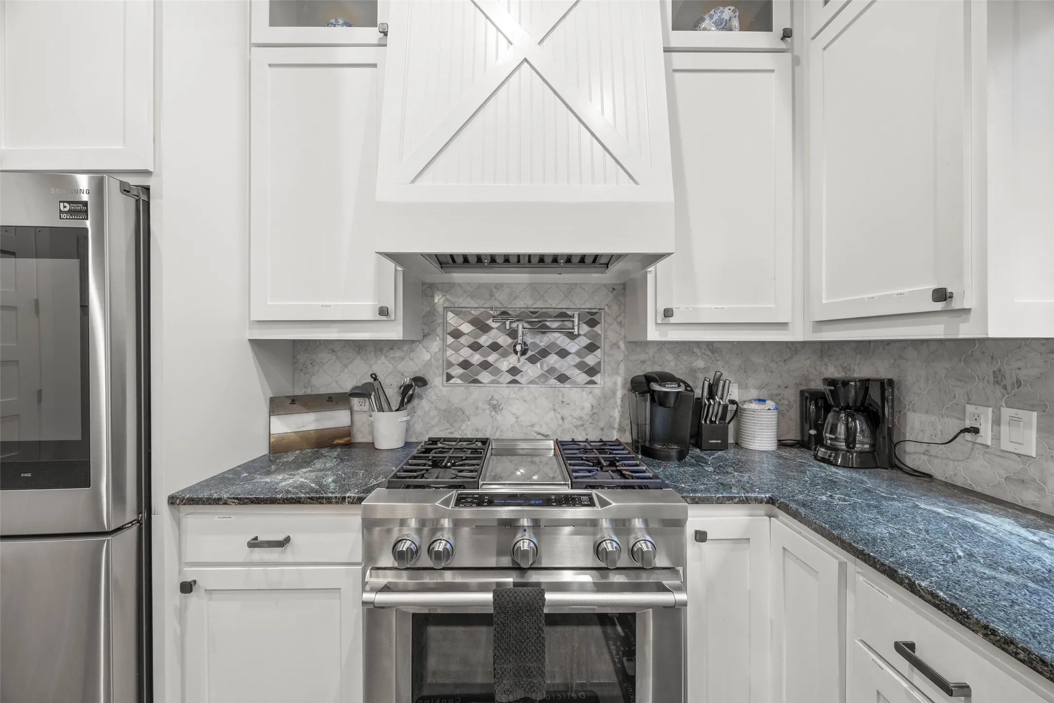 Gas stove with griddle with a convenient pot filler