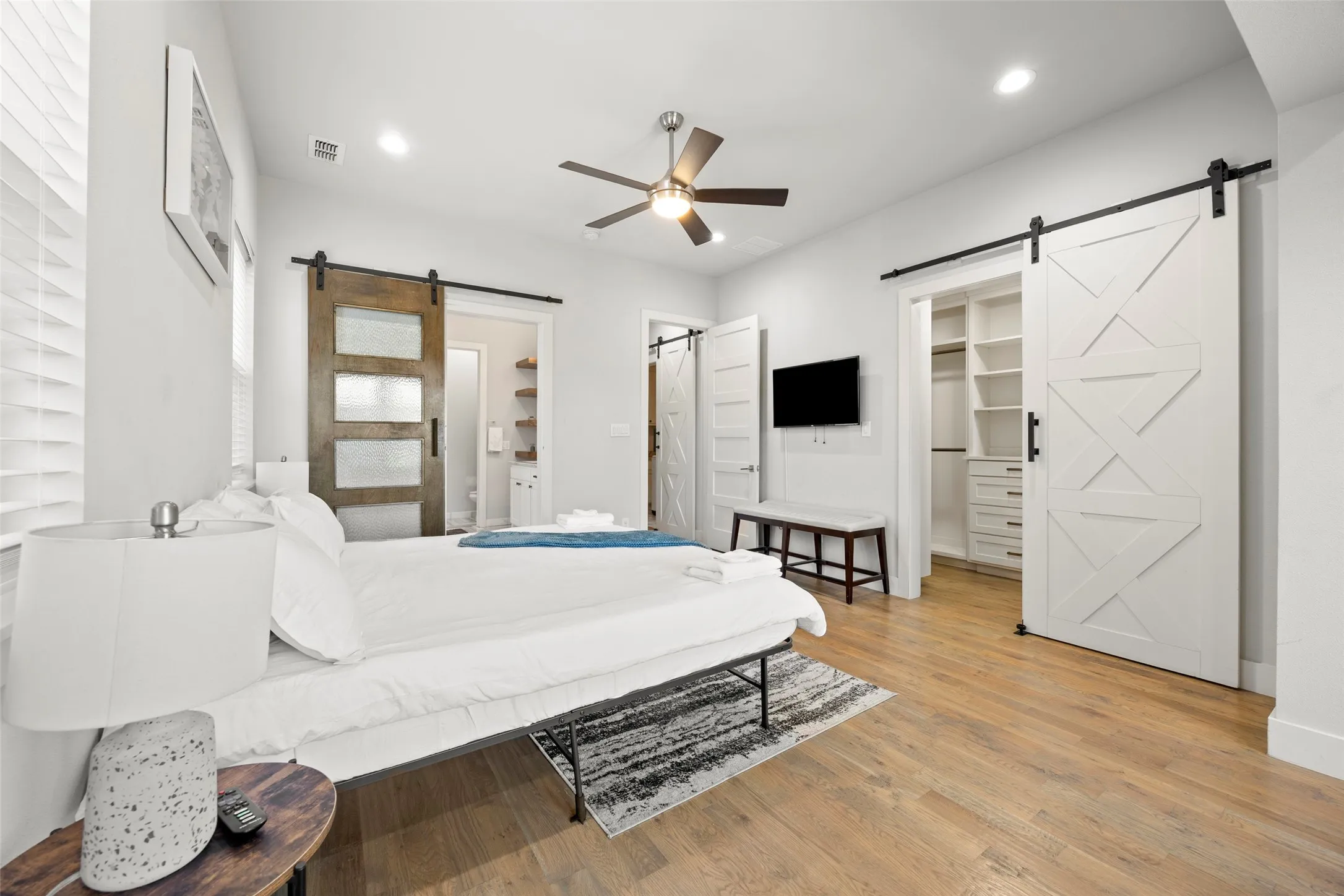 The massive primary suite features a sitting room with a door to the balcony, en-suite bath and huge closet with built-in shelving