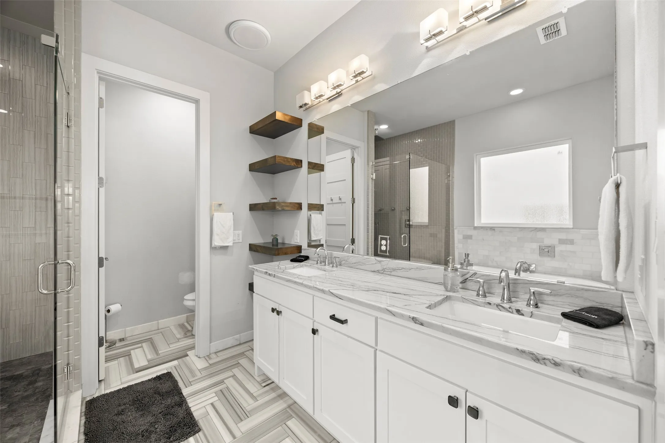 Primary bathroom features free-standing tub, shower and double sinks