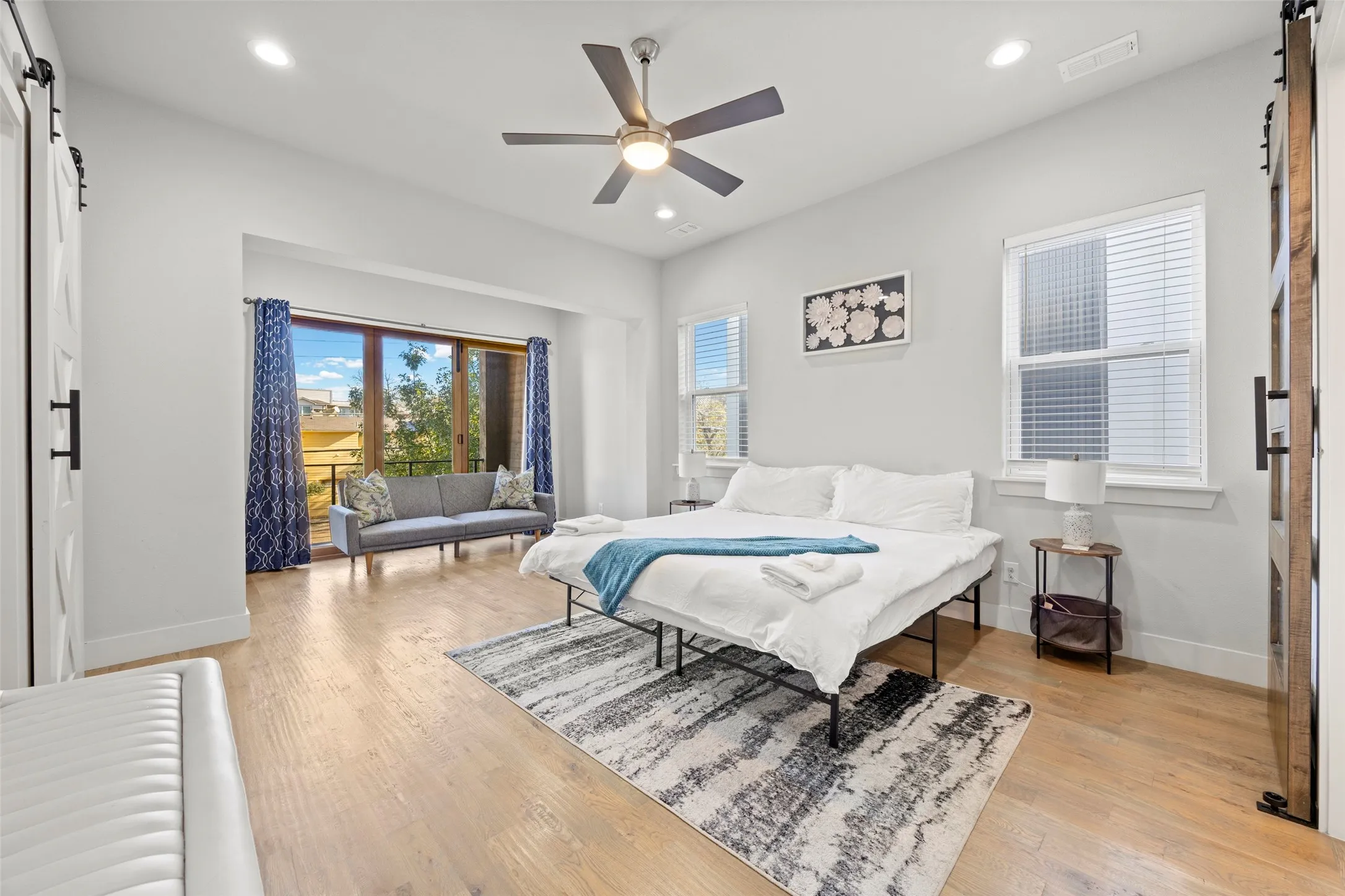 The massive primary suite features a sitting room with a door to the balcony, en-suite bath and huge closet with built-in shelving