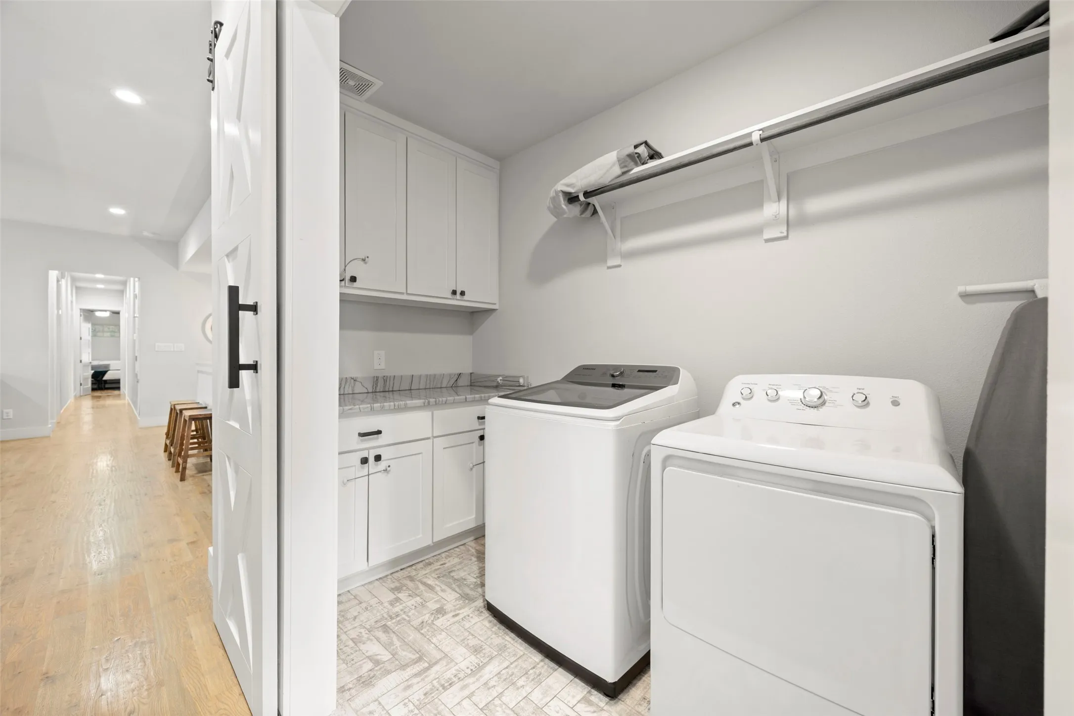 Upstairs laundry room is convenient to all of the bedrooms