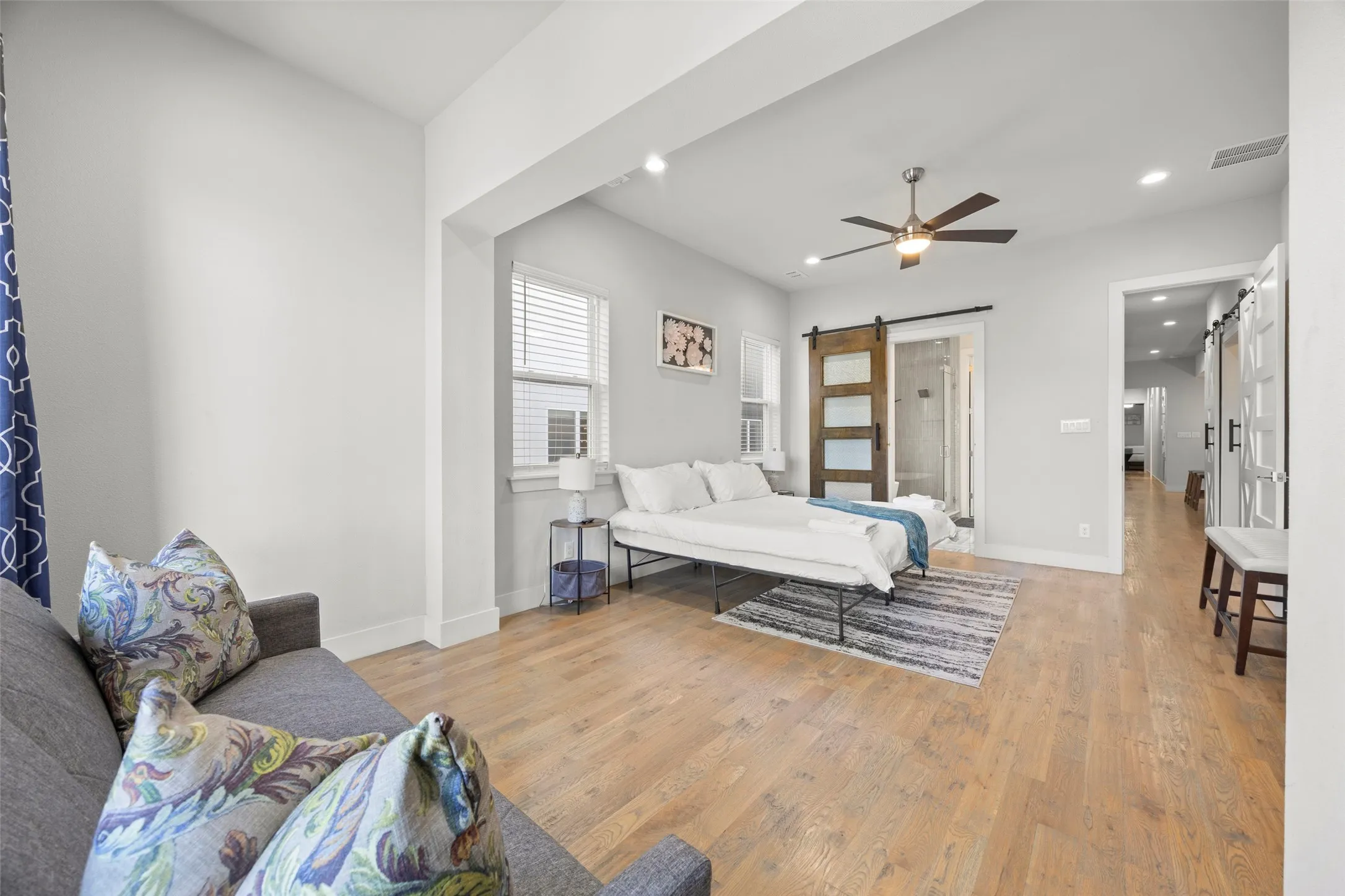 The massive primary suite features a sitting room with a door to the balcony, en-suite bath and huge closet with built-in shelving