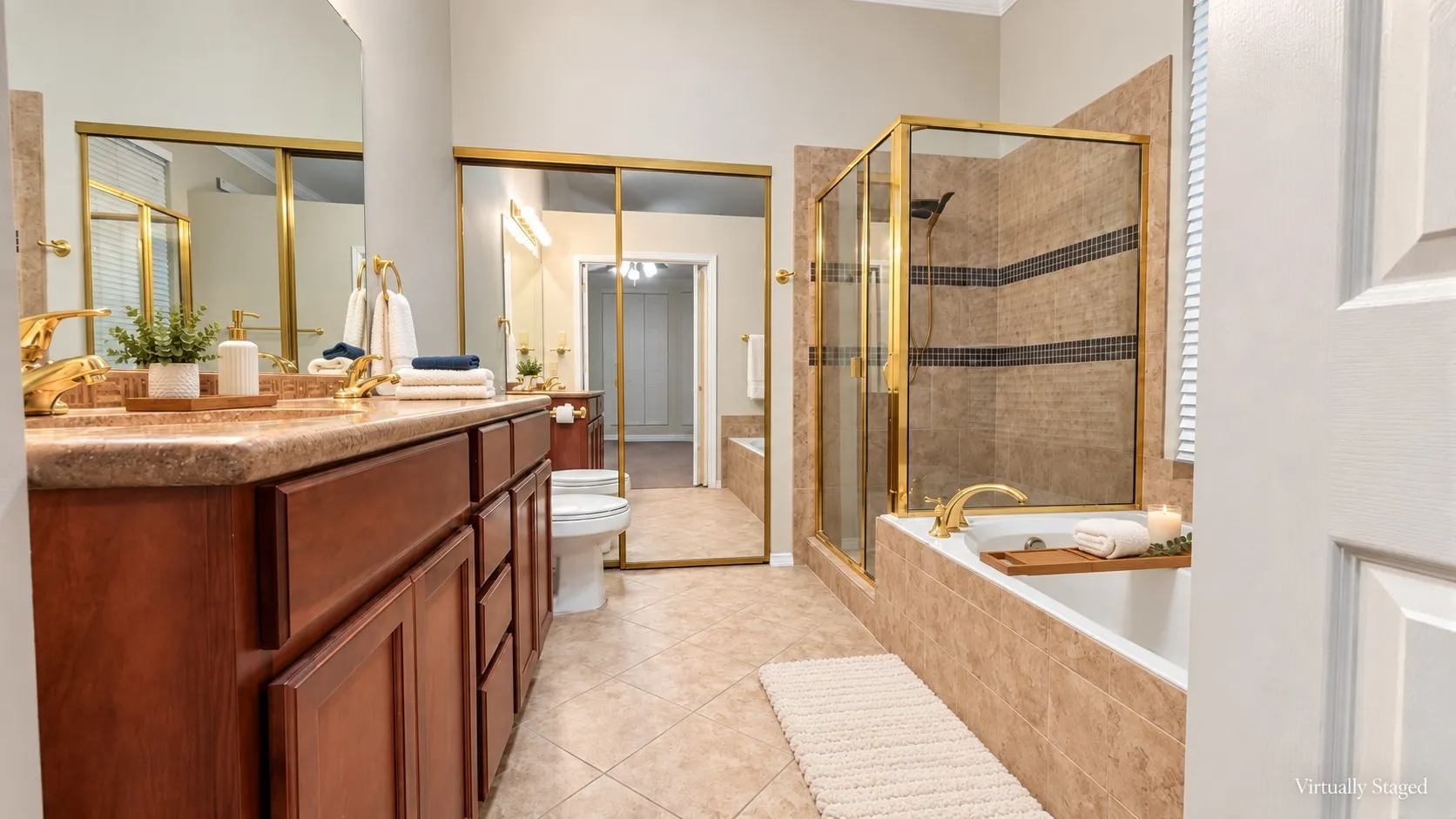 Dual vanity with gold-finish fixtures and an integrated countertop