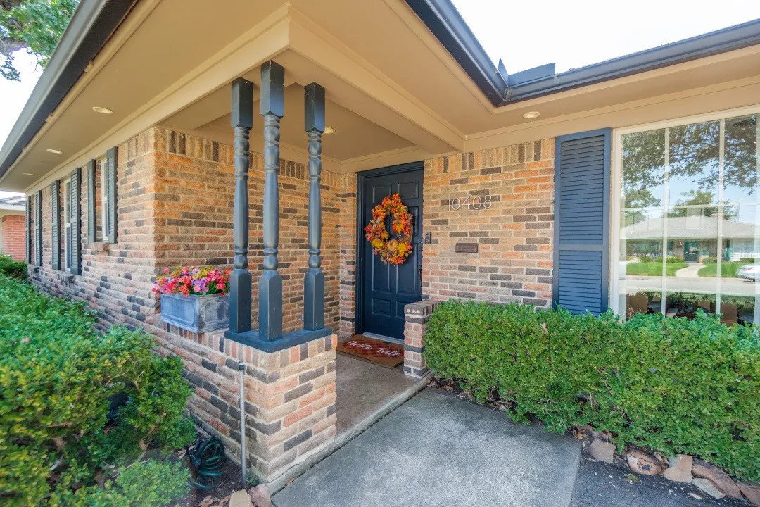 Welcoming covered entrance to this beautiful, well-maintained home.