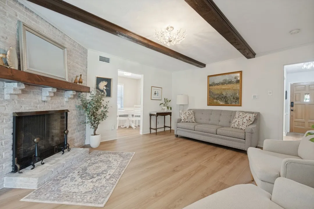 Living Room is 17x13 and opens to the entry, breakfast area, & the glass entrance to the covered patio.