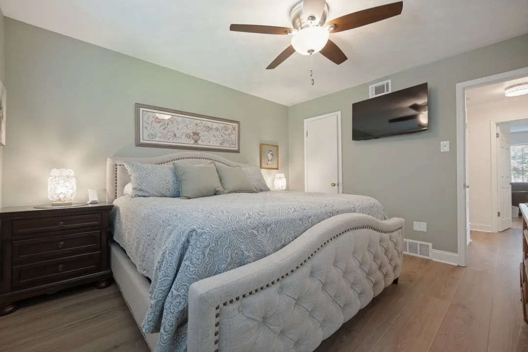 Bedroom 2 has a ceiling fan, walk-in closet, & LVP floor.