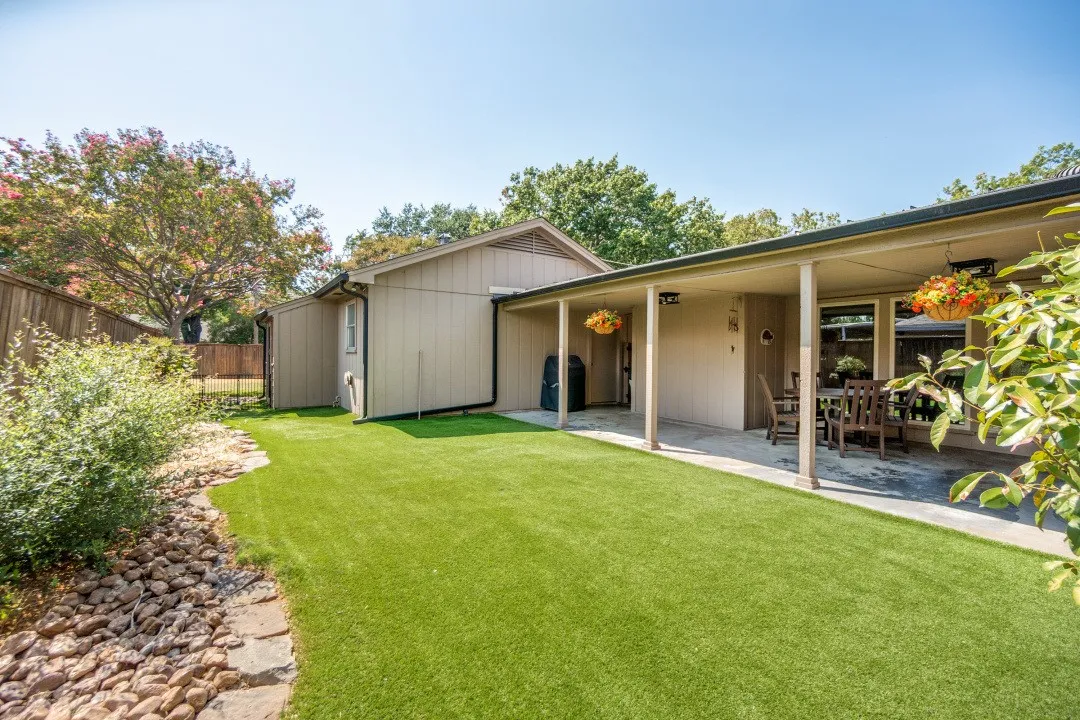 Green year-round with synthetic turf beside the big patio. Morning sun & afternoon shade.
