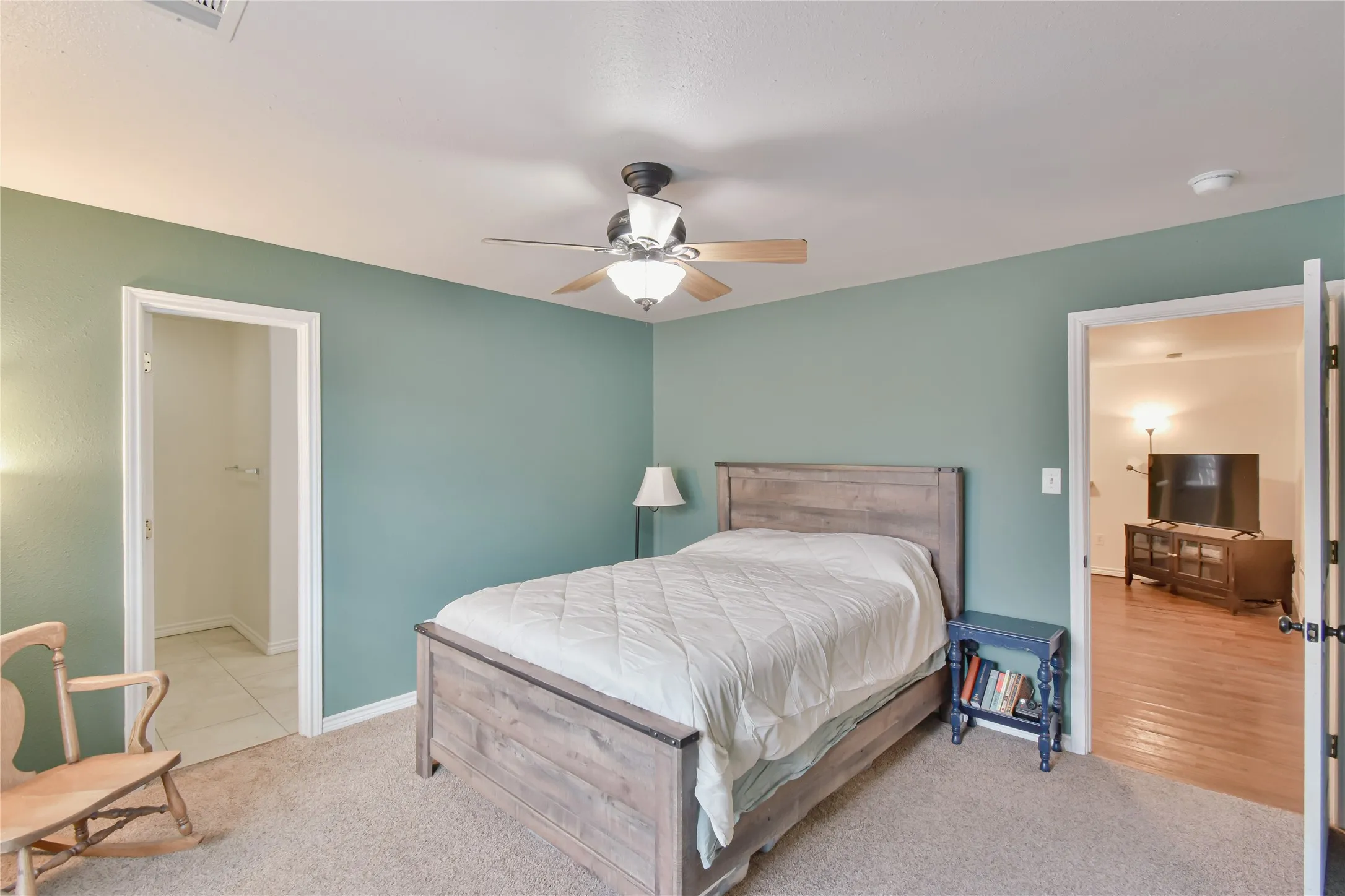 Carpeted bedroom featuring a ceiling fan with integrated​​‌​​​​‌​​‌‌​‌‌​​​‌‌​‌​‌​‌​​​‌​​ lighting