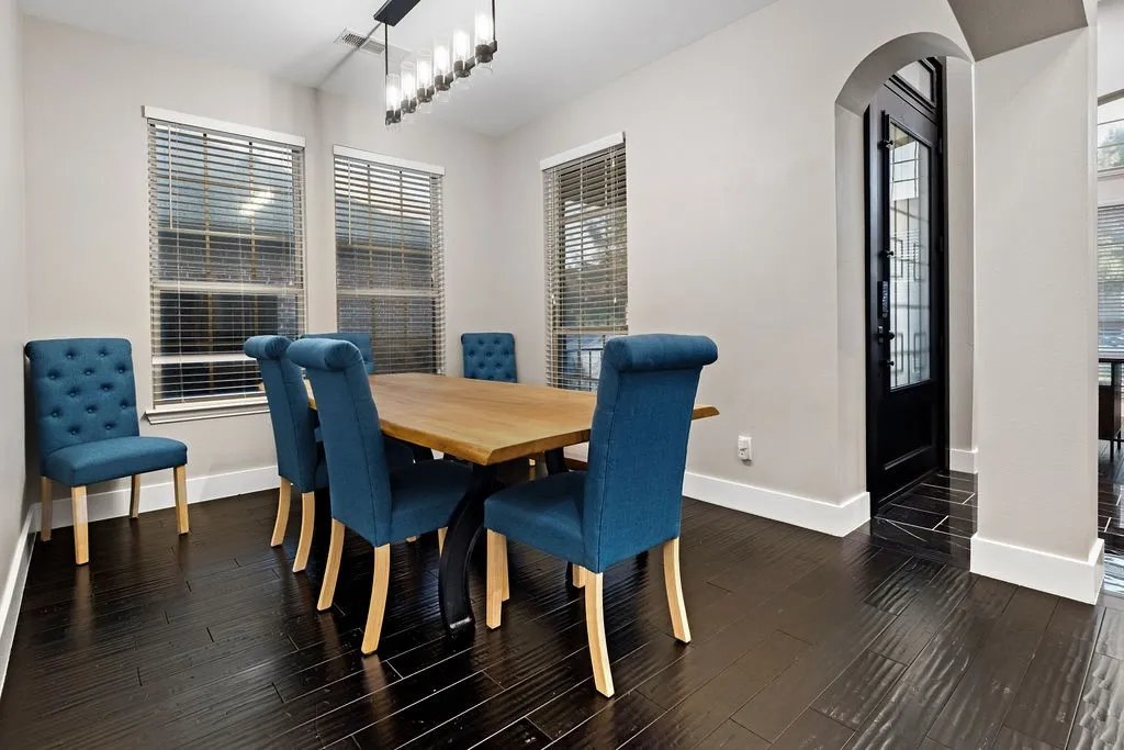 Dark wood-finish flooring with white trim