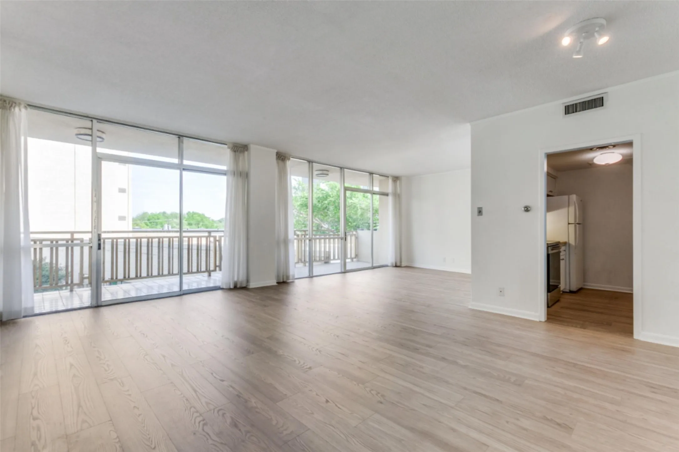 Living-dining area has balcony access