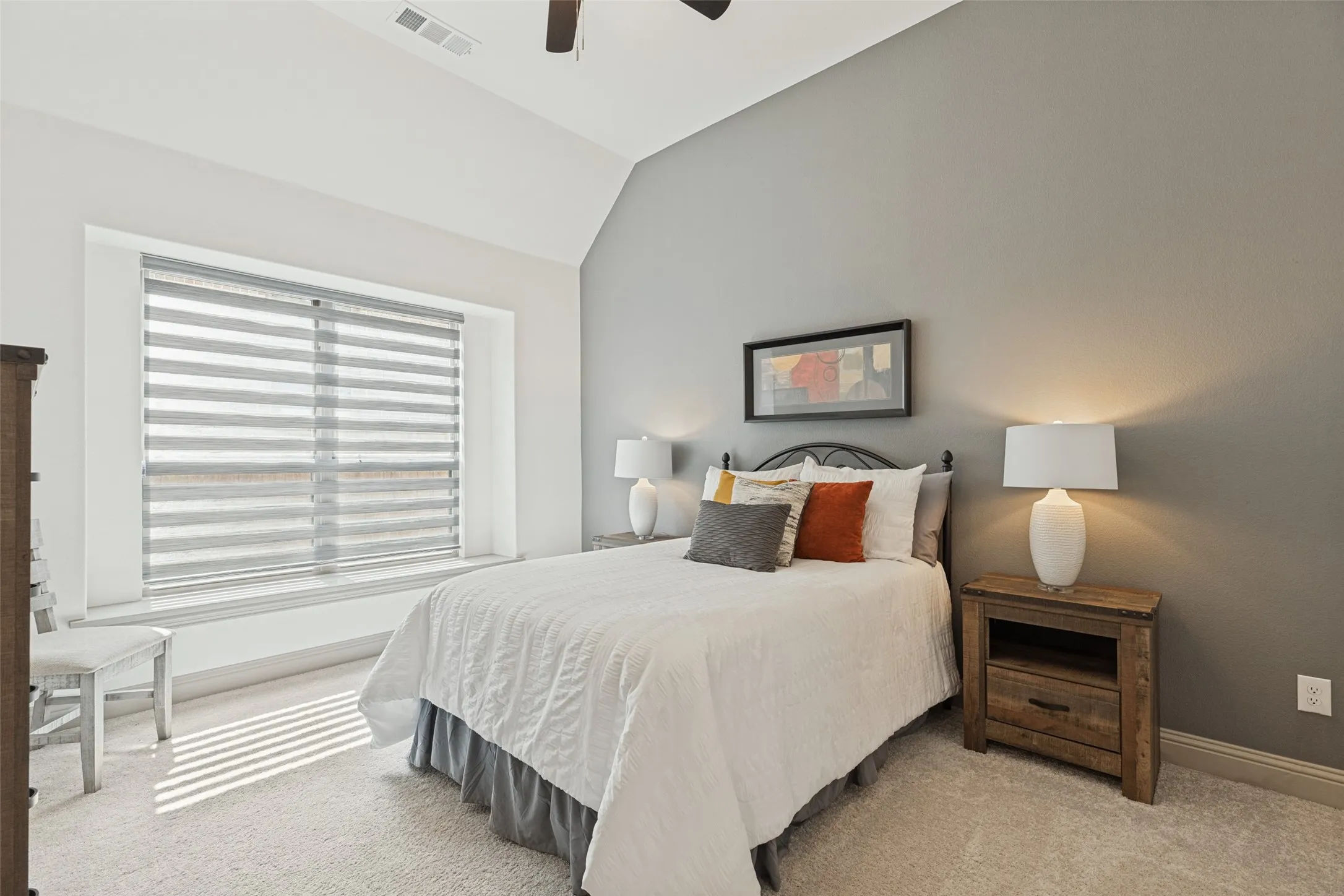 Large bedroom with high ceiling and an abundance of light