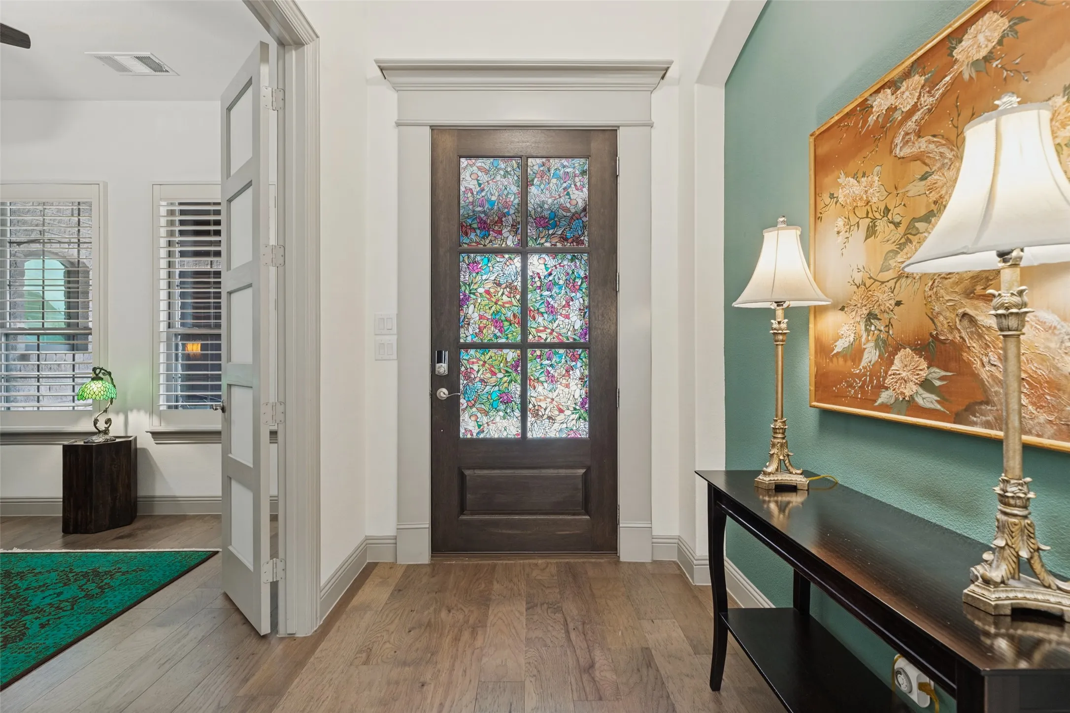 Front entry of home with view of french doors leading into study