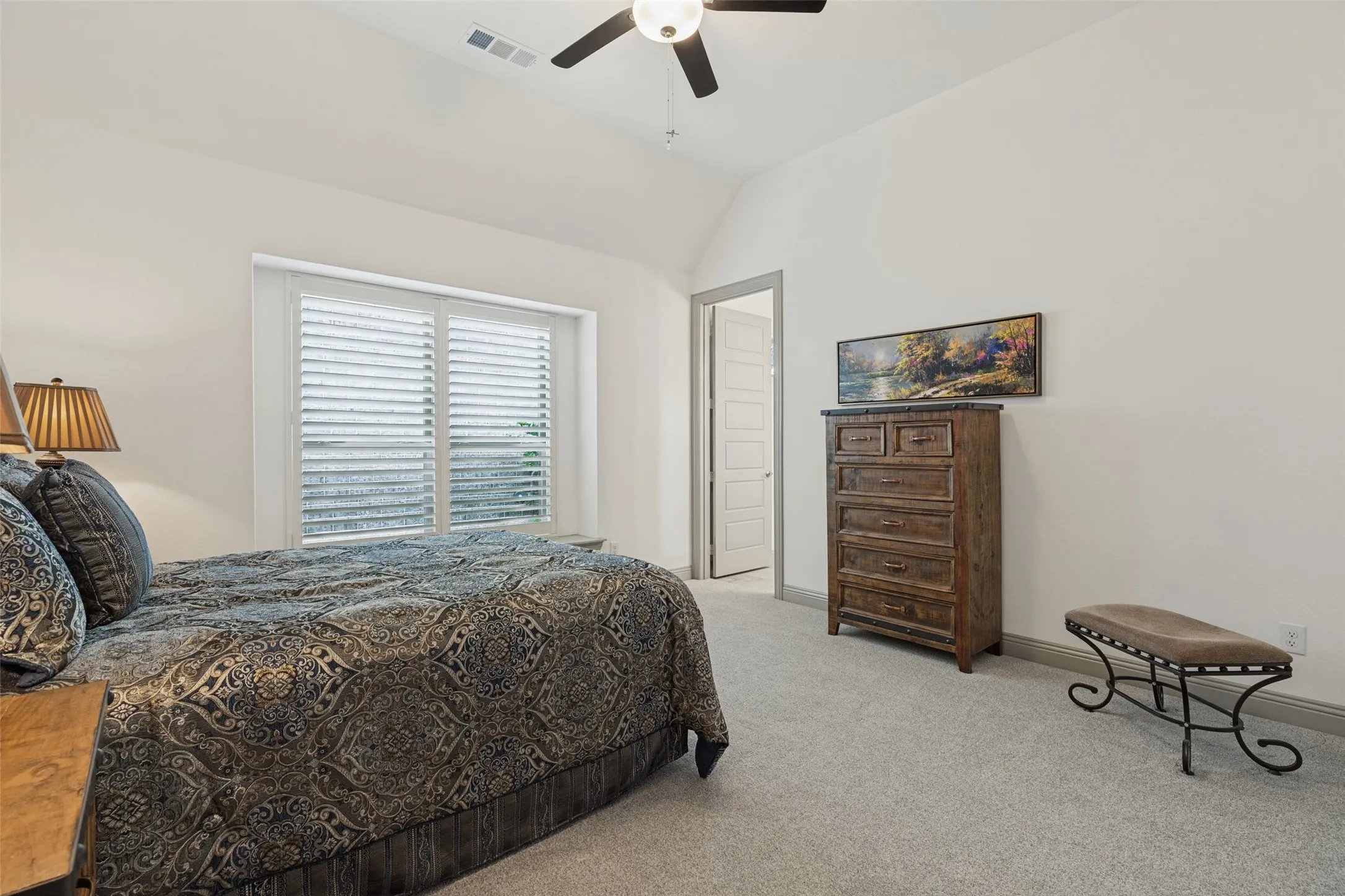large guest suite with ensuite bath at front of home off secondary front entrance