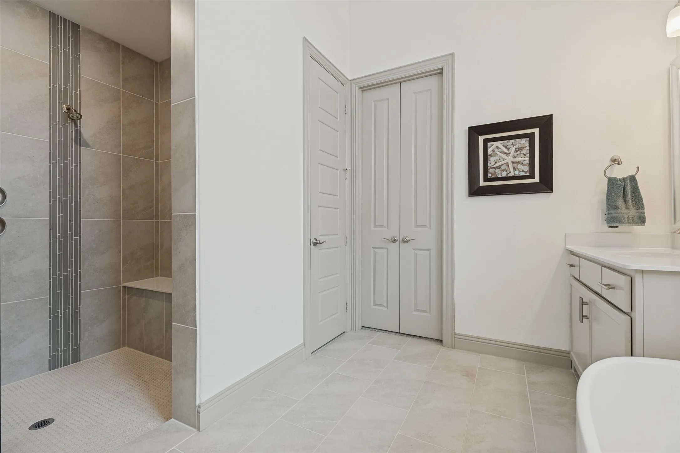 Relax in the oversized shower with bench seat