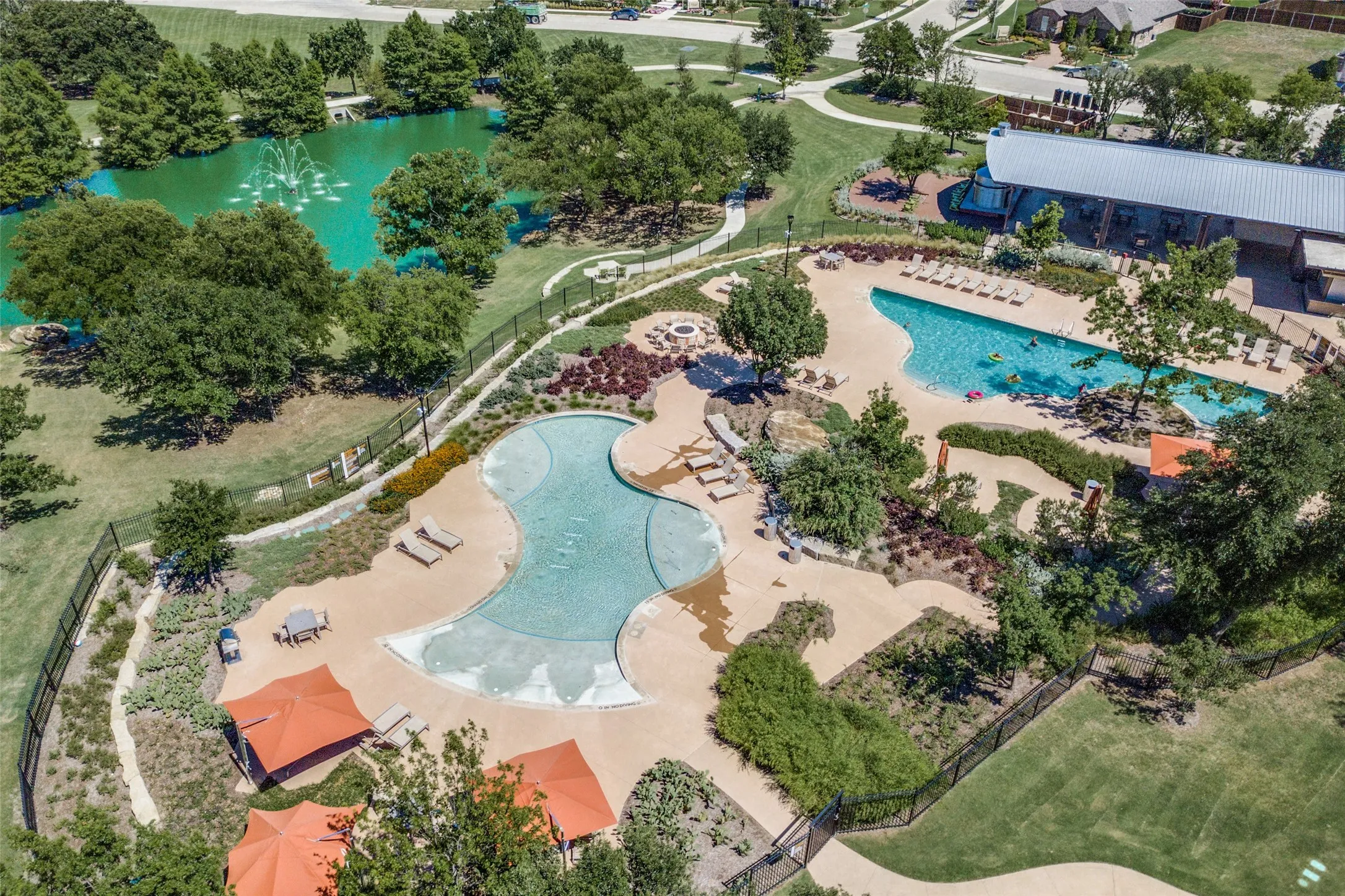 View of the amenities in Wildridge, 2 pools, clubhouse, playground, walking trails