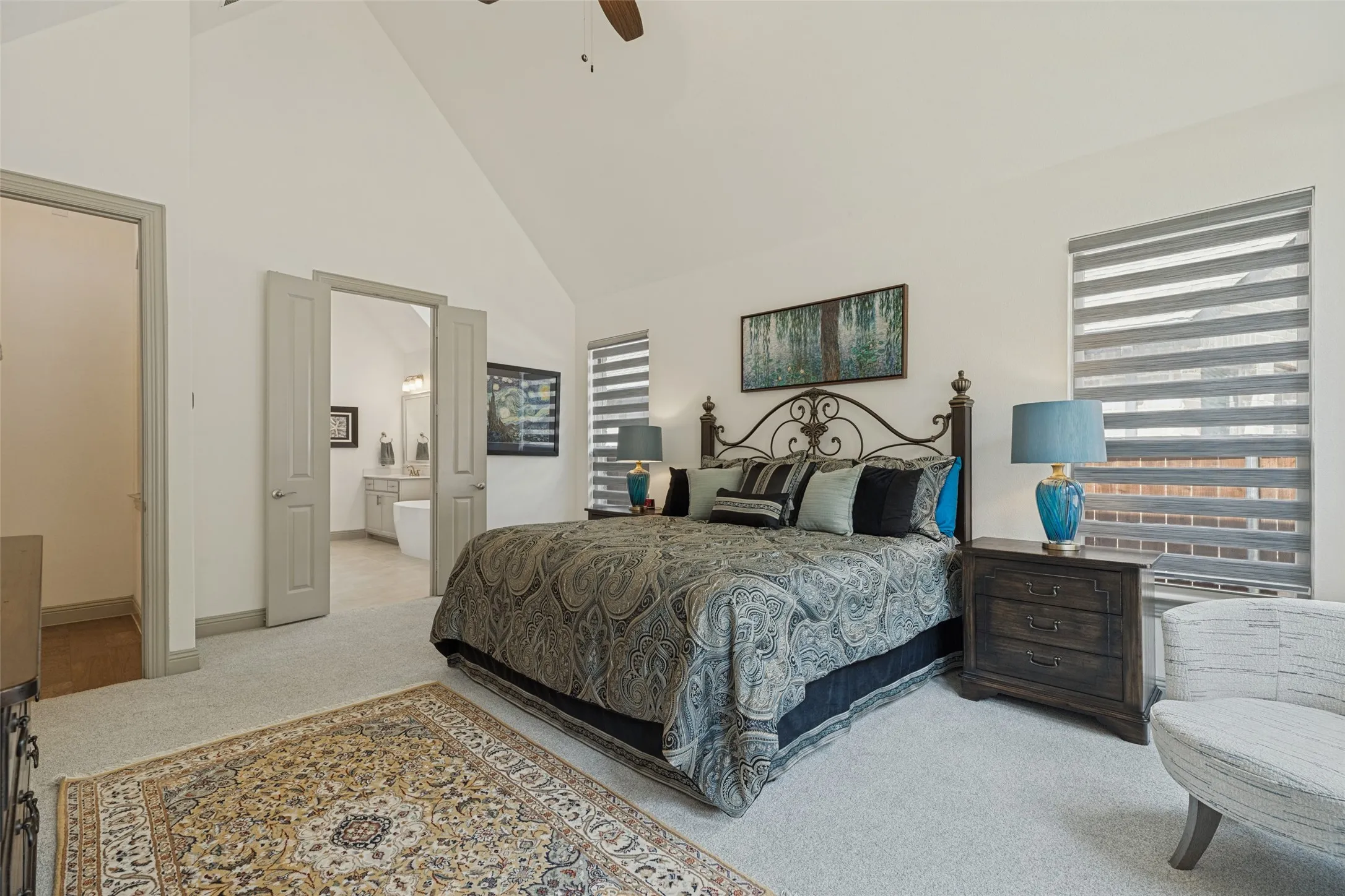 Beautiful master suite with french doors leading into master spa bath