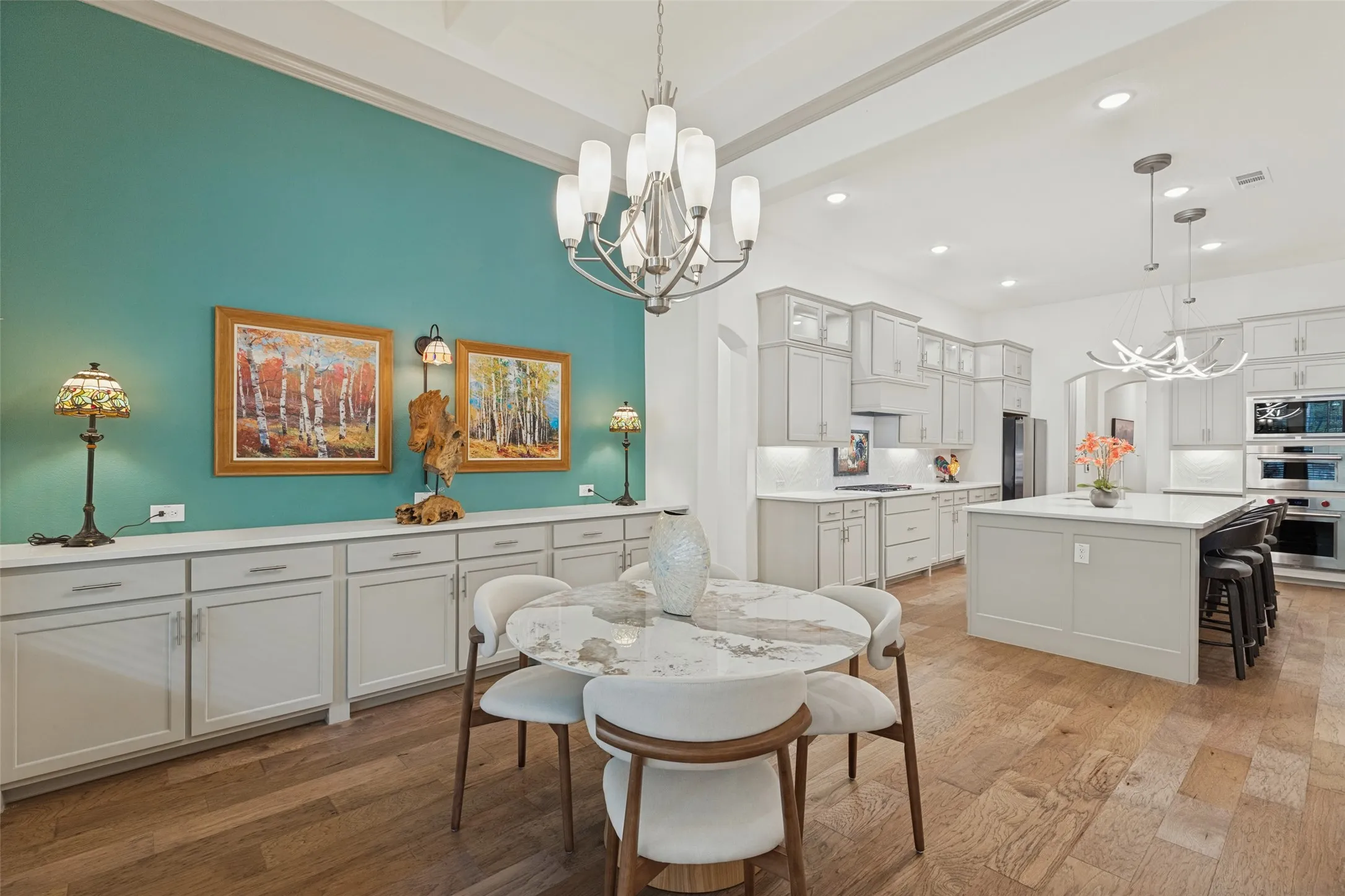 Dining area off kitchen with an abundance of built in cabinets and storage. Perfect for entertaining!