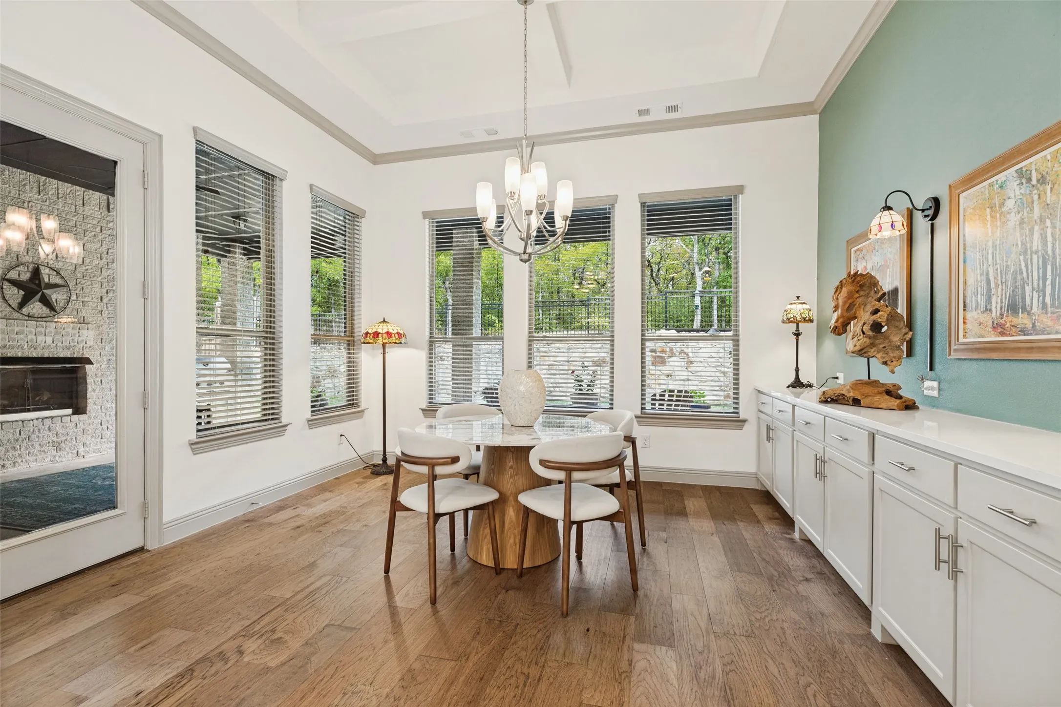 Dining area with an abundance of windows and easy access to the large Texas style back patio with fireplace and two sitting areas where you can enjoy the peaceful backyard