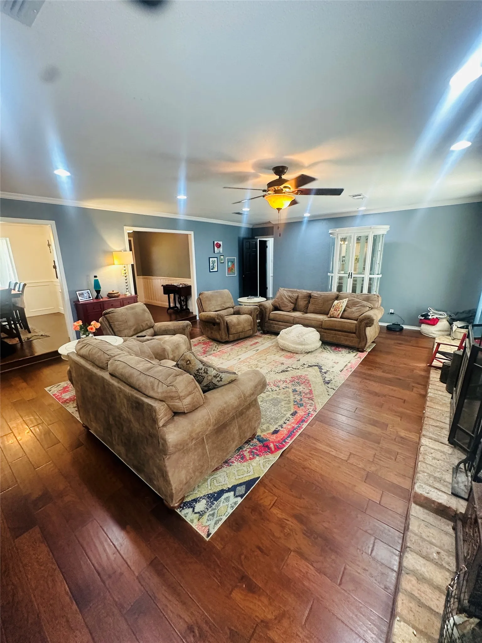 Wood-finish flooring throughout, recessed ceiling lighting, ceiling fan with integrated light