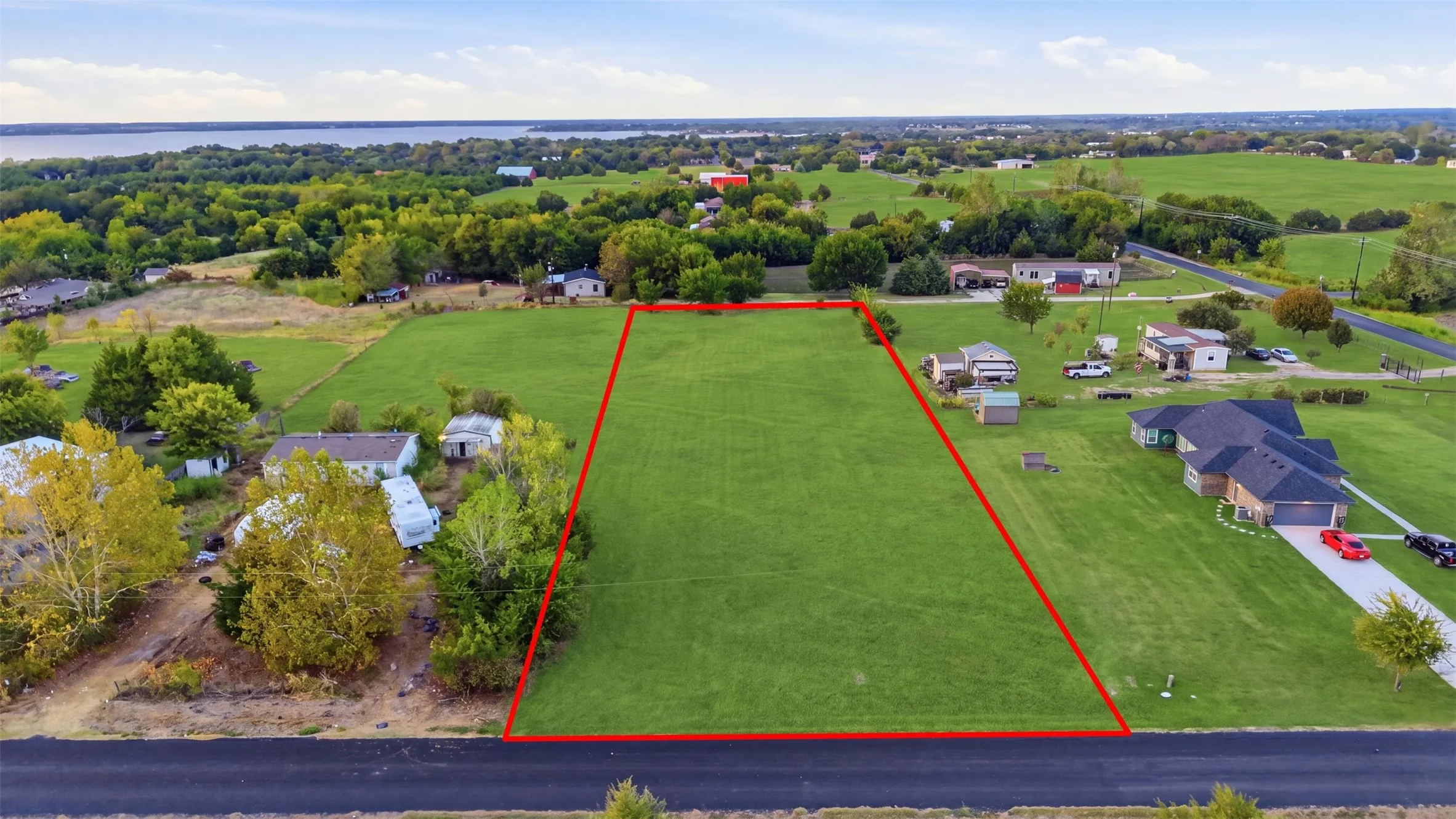Expansive lot featuring a clear, level grass expanse