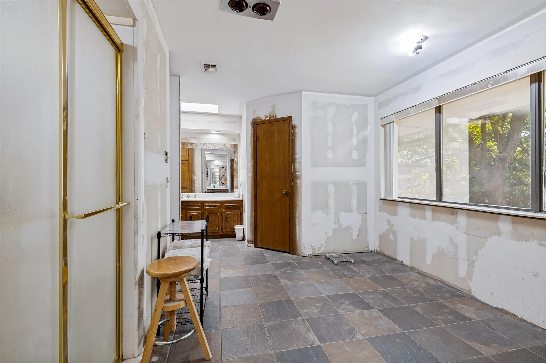 Primary bath is partially renovated and ready for the next owner to complete with finishes and selections of their own.