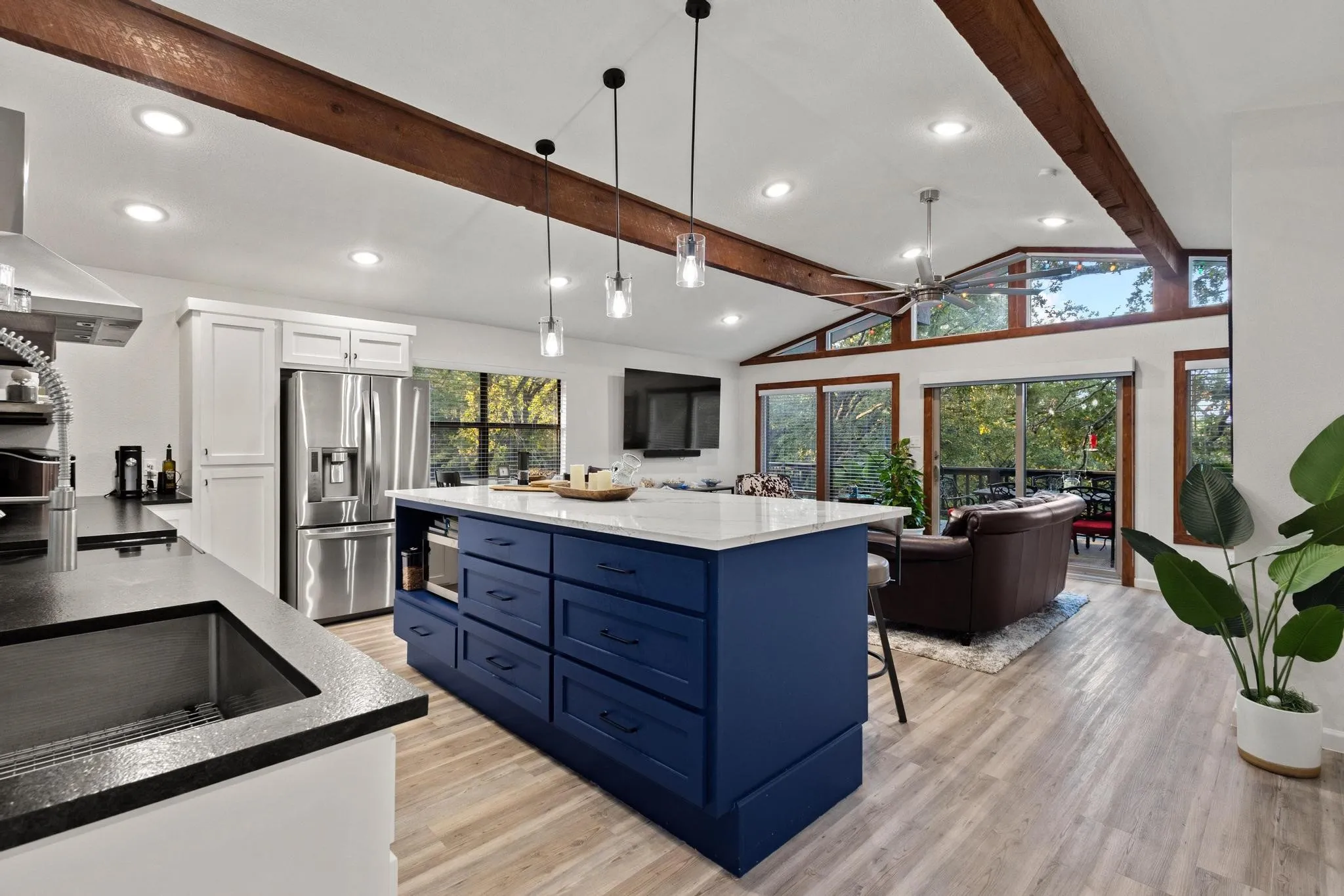 With High Ceilings, Natural Light and Warm Wood Beams, the Main Living Areas are Stunning!