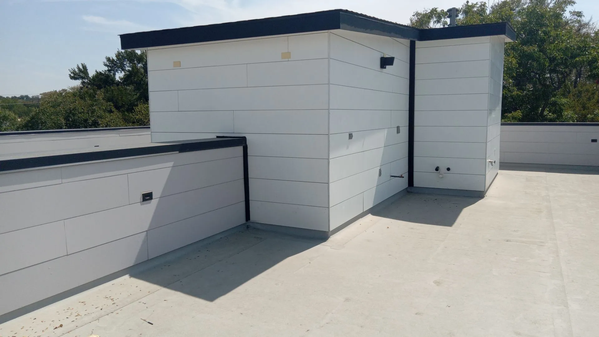 Rooftop deck featuring a flat roof and surrounding parapet walls