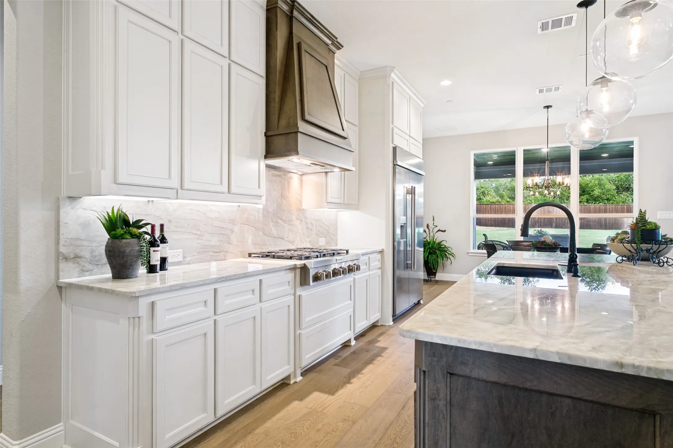 Custom Cabinetry, SS Appliances & Quartzite Counter Tops.
