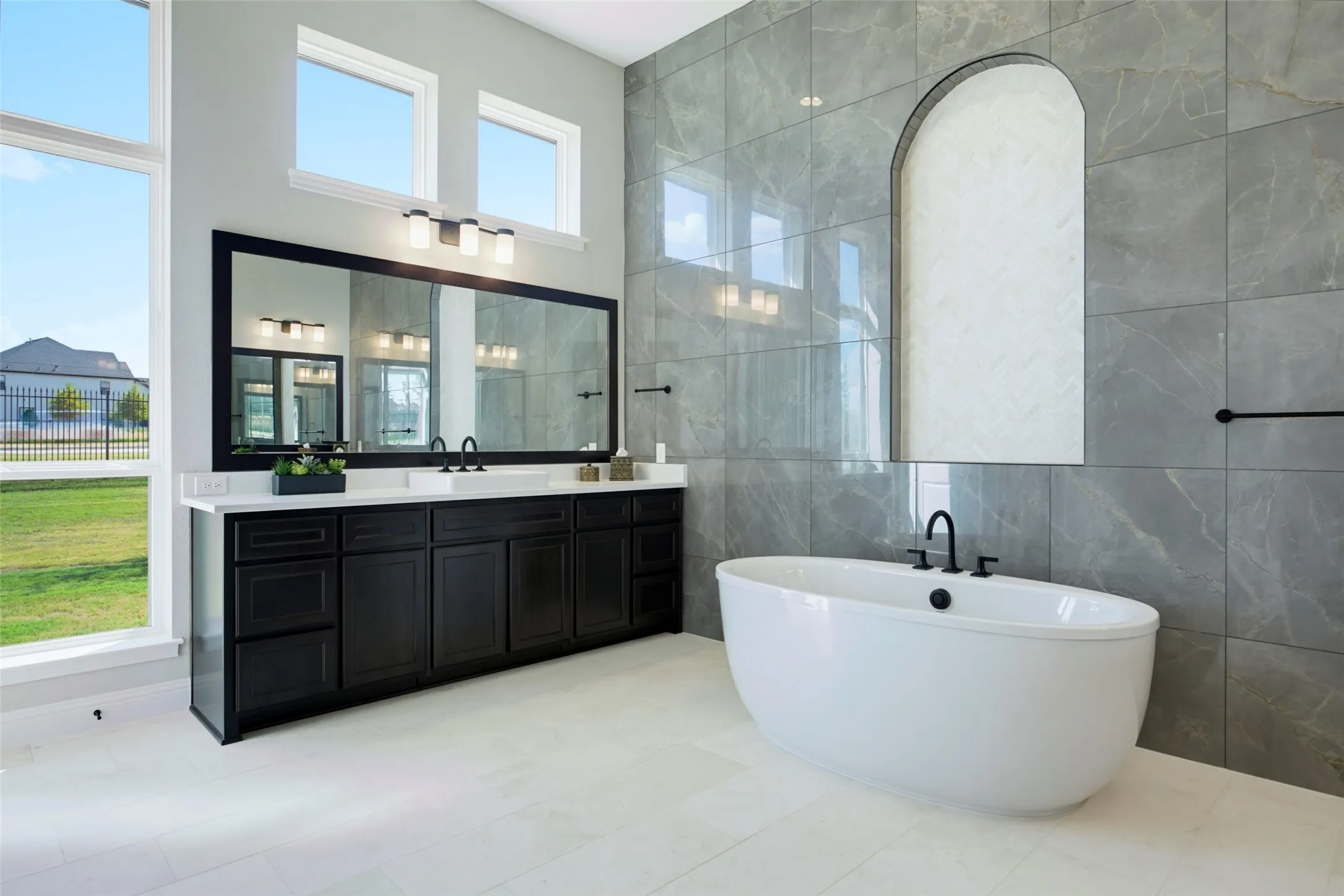 Primary Bath w/Dual Vanities & An Elegant Bathtub.