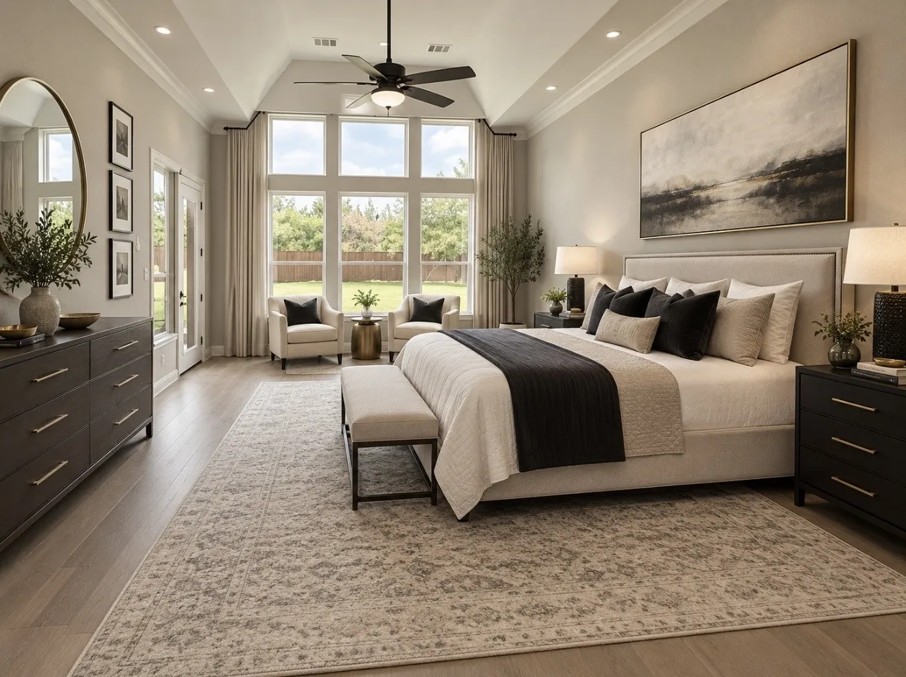 Downstairs Primary Bedroom w/Sitting Area. Virtually Staged.