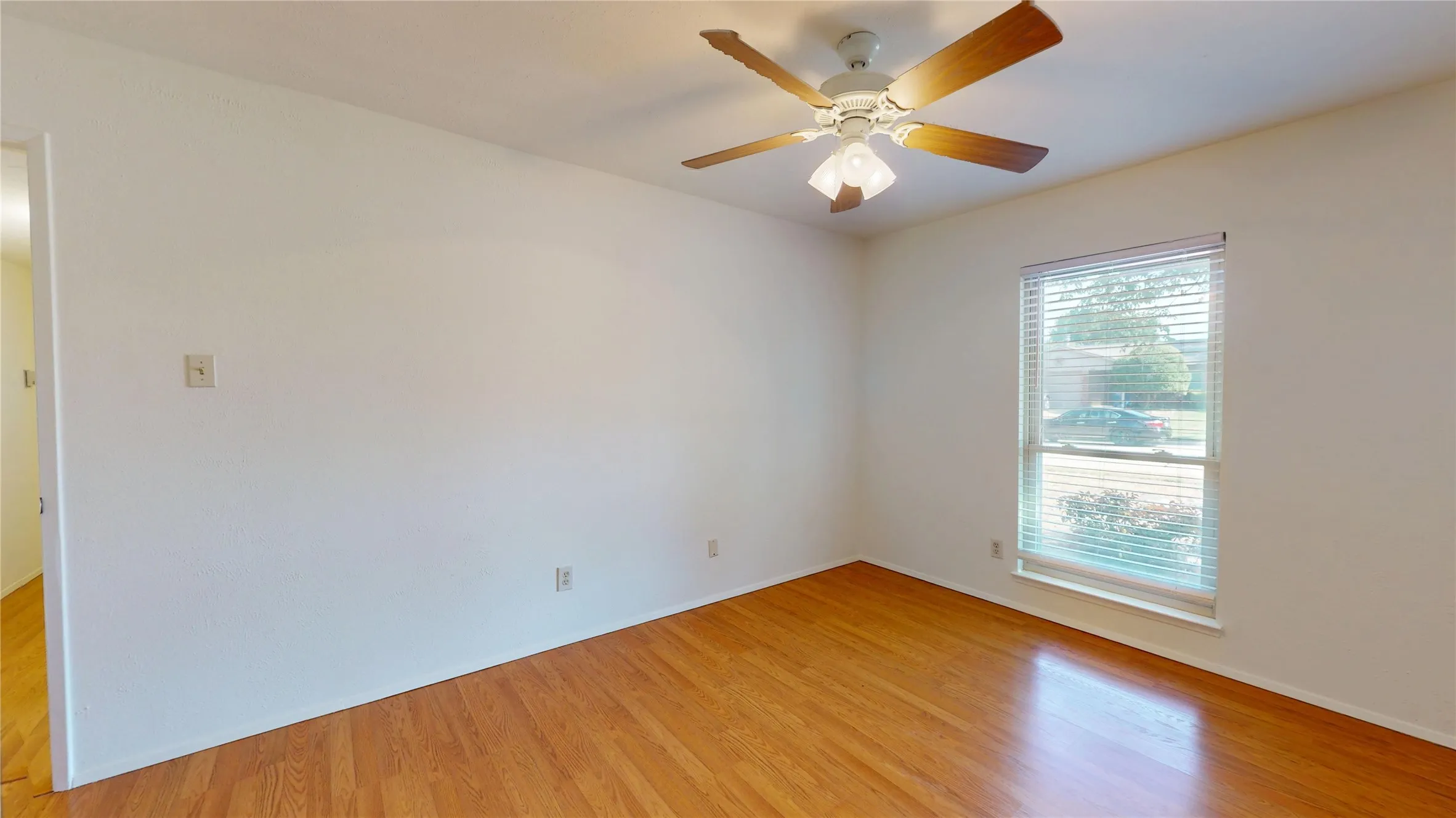Hardwood flooring, painted walls, ceiling fan, window, recessed lighting