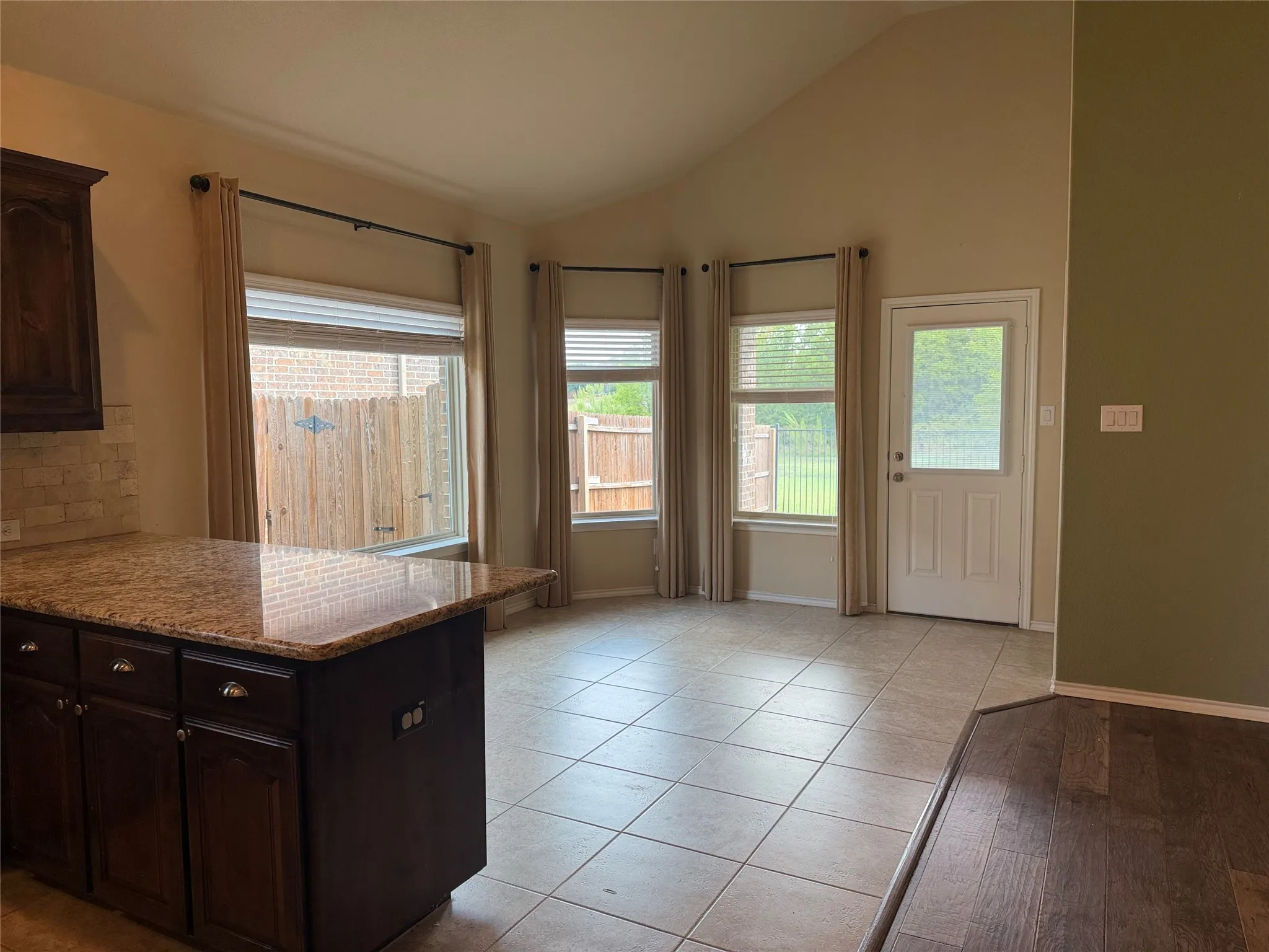 View of dining area with breakfast bar.