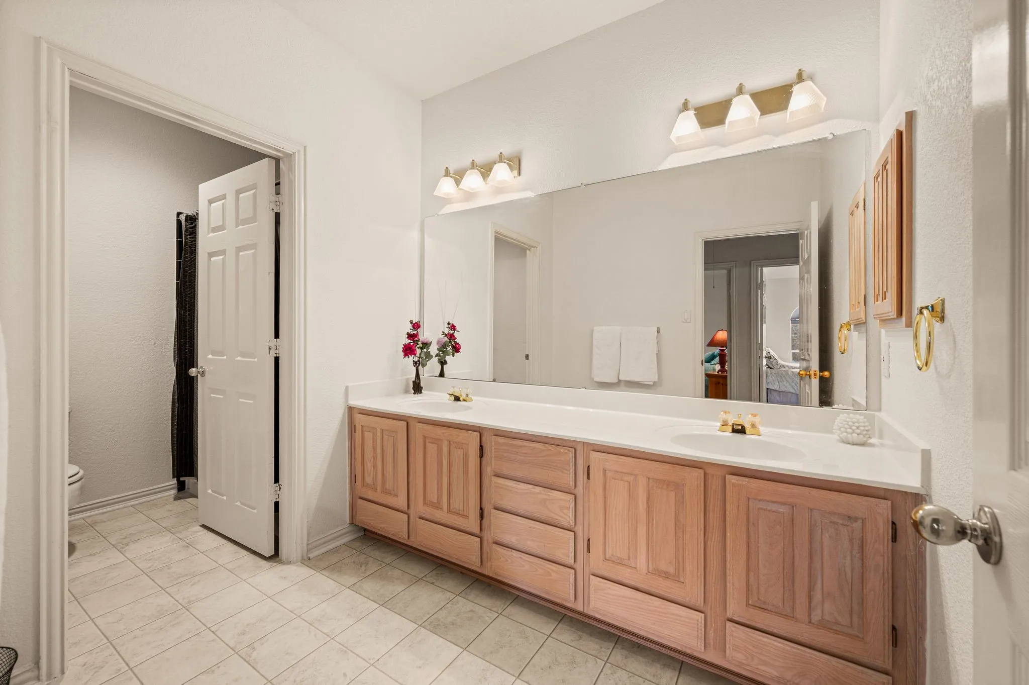 Double vanity with a white countertop and integrated sinks
