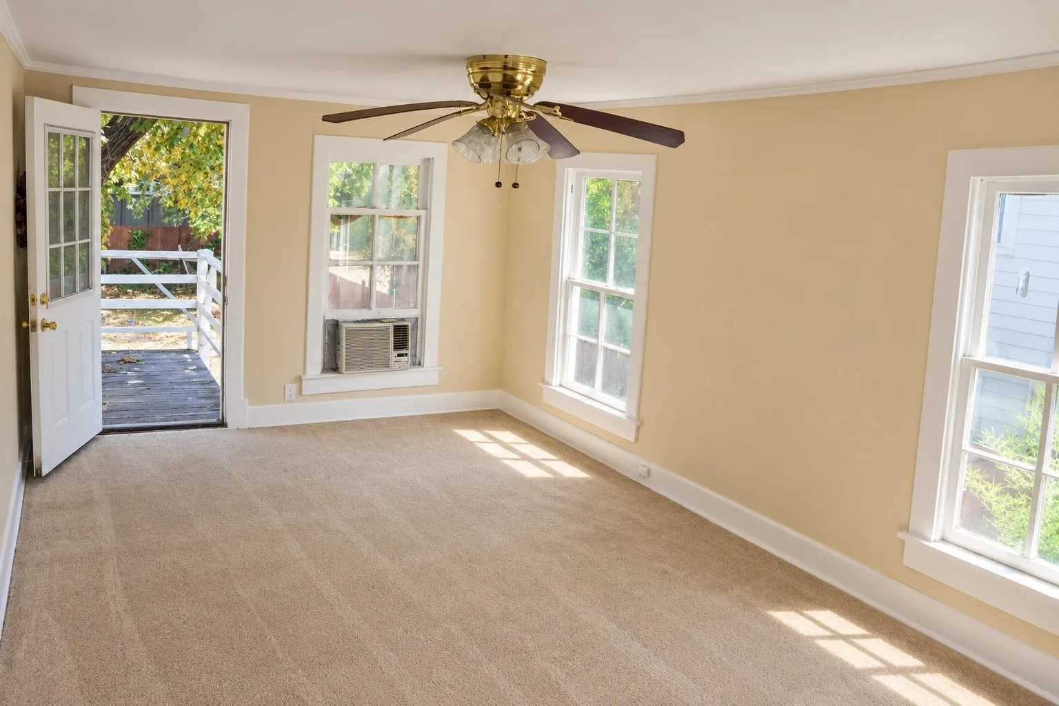 Upper-level room showing exterior deck door access