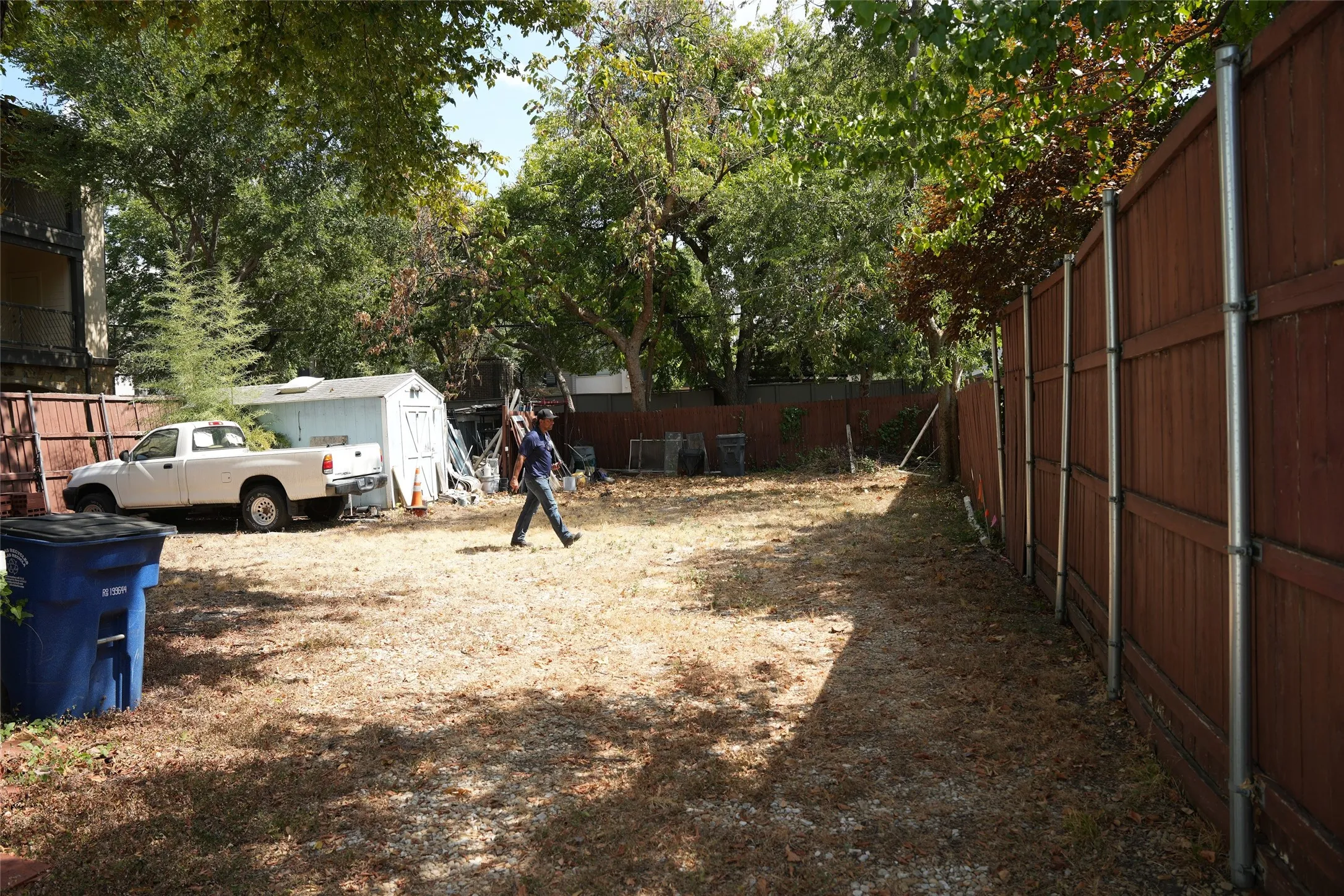Rear yard area leading toward the back alley gate.