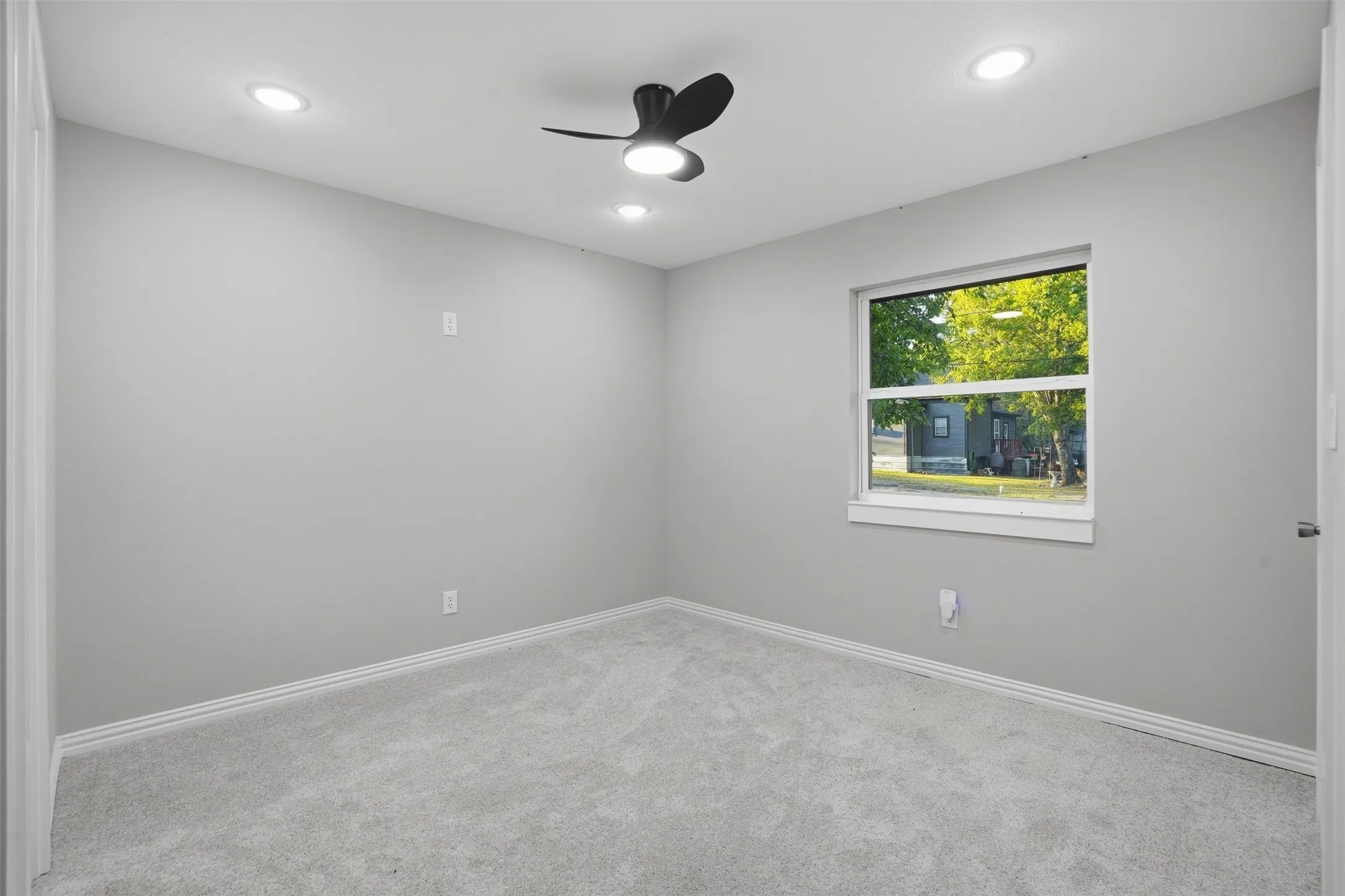 Neutral-toned walls with recessed lighting