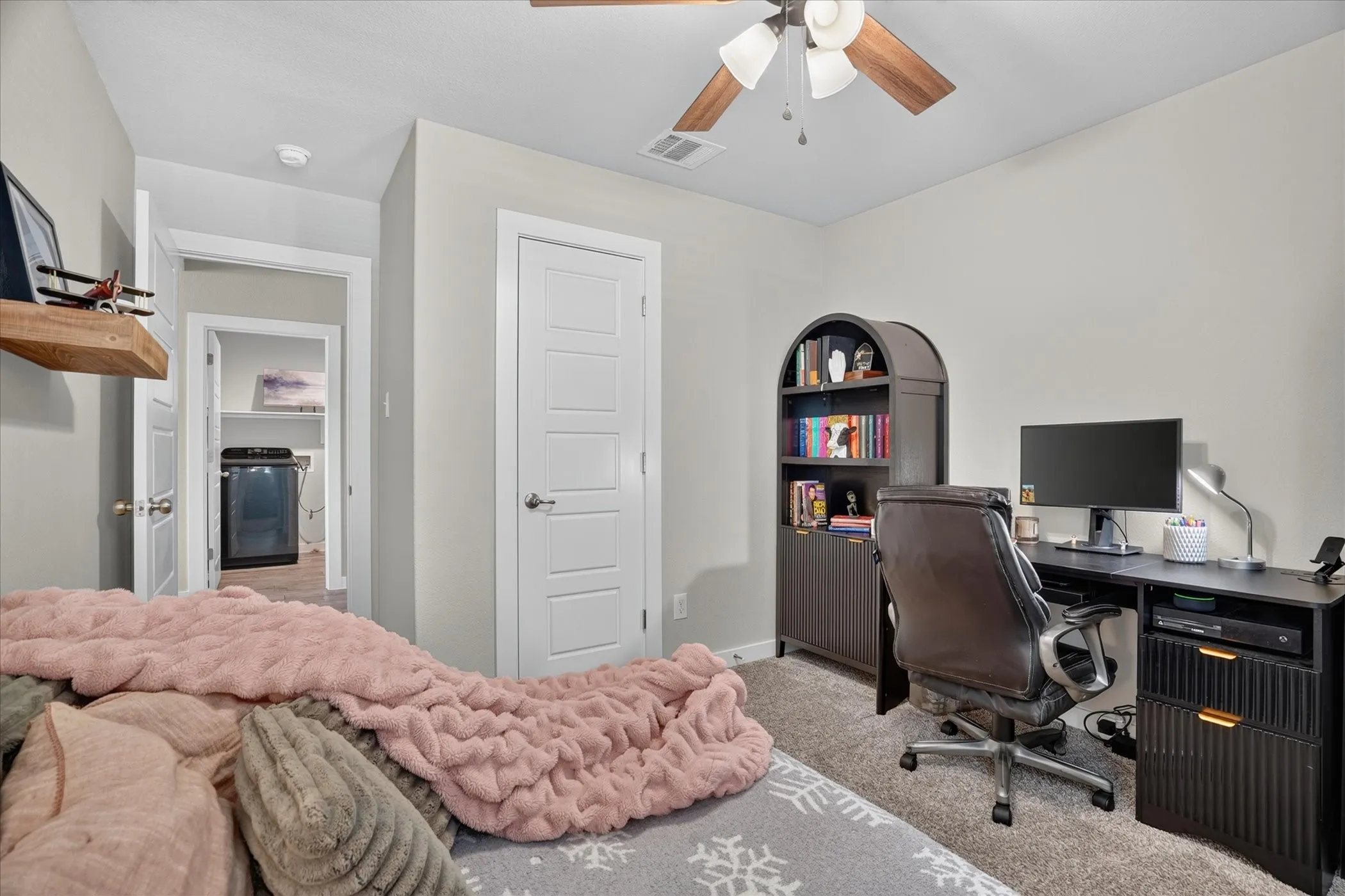 Ceiling fan with wood-finish blades and integrated lighting